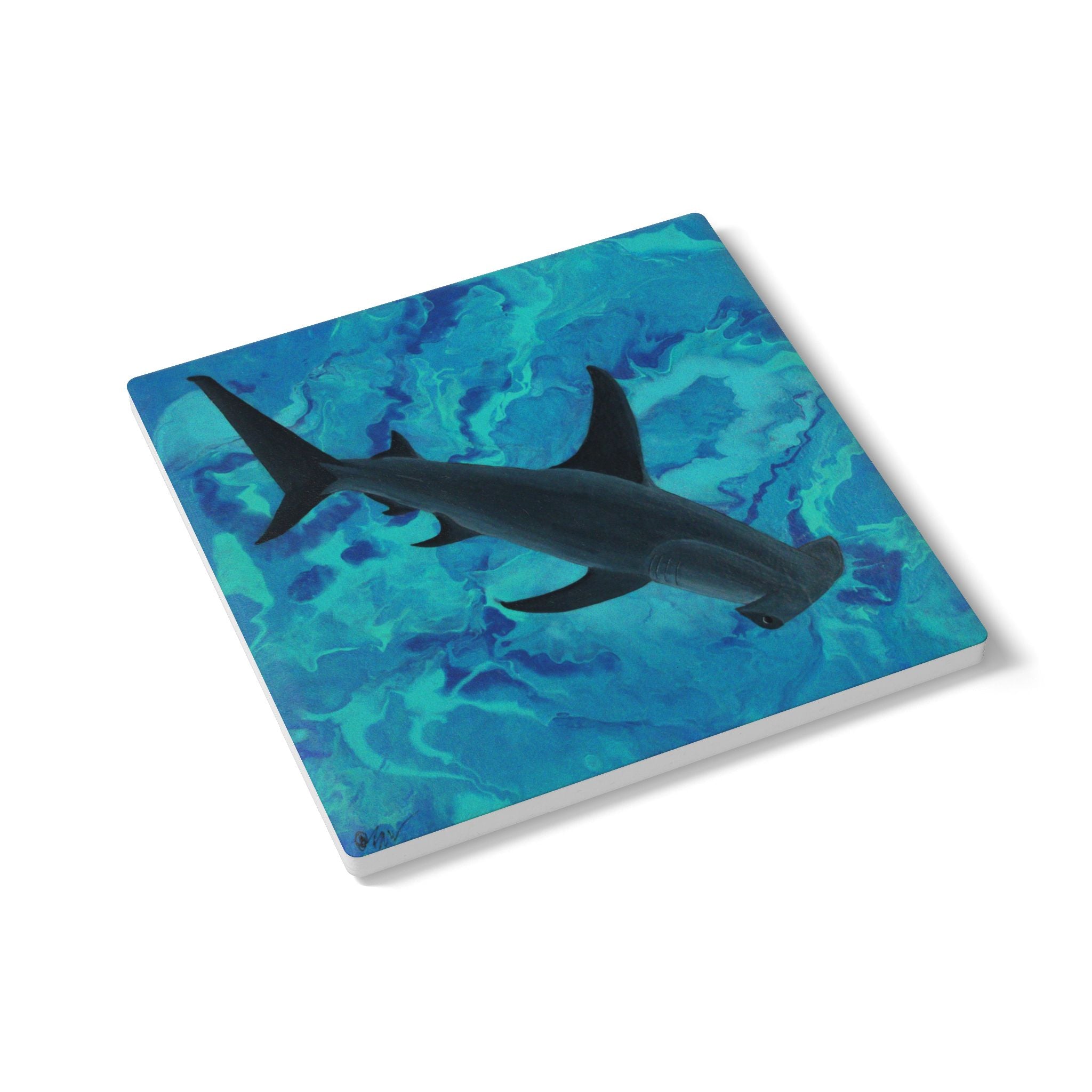 Coaster with a shark design on a blue watercolor background