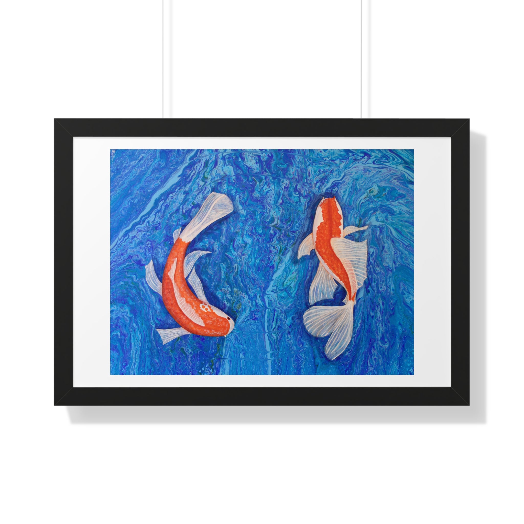Framed artwork of two koi fish on a blue background