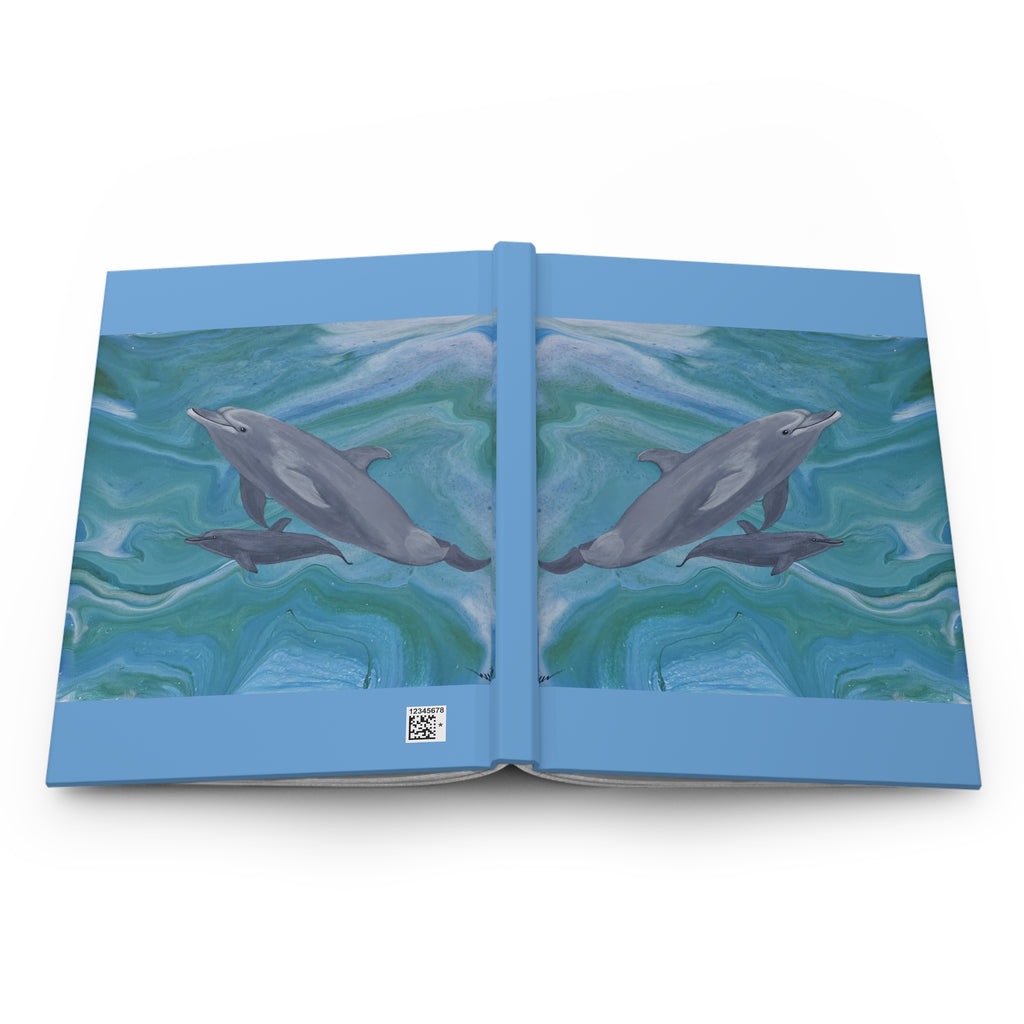 Open book with dolphin illustration on a white background