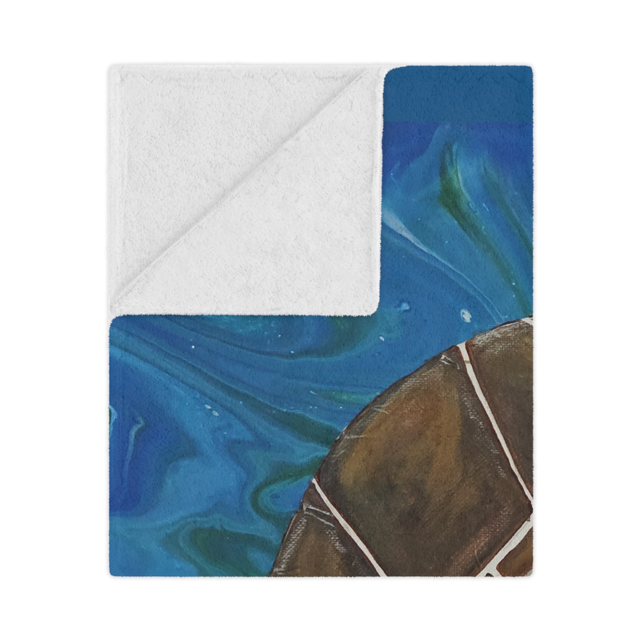 Folded blanket with blue and brown abstract pattern on a white background