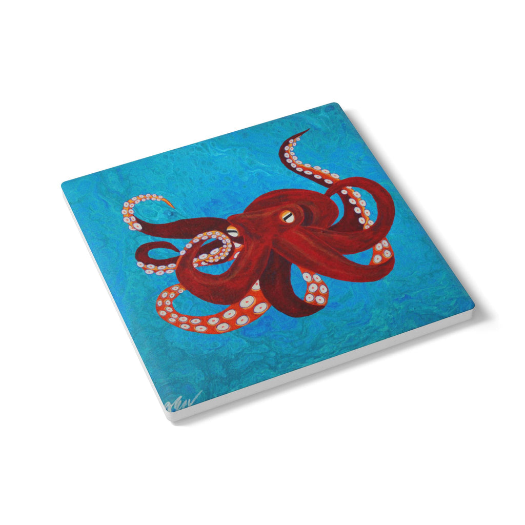 Coaster with a red octopus design on a blue background