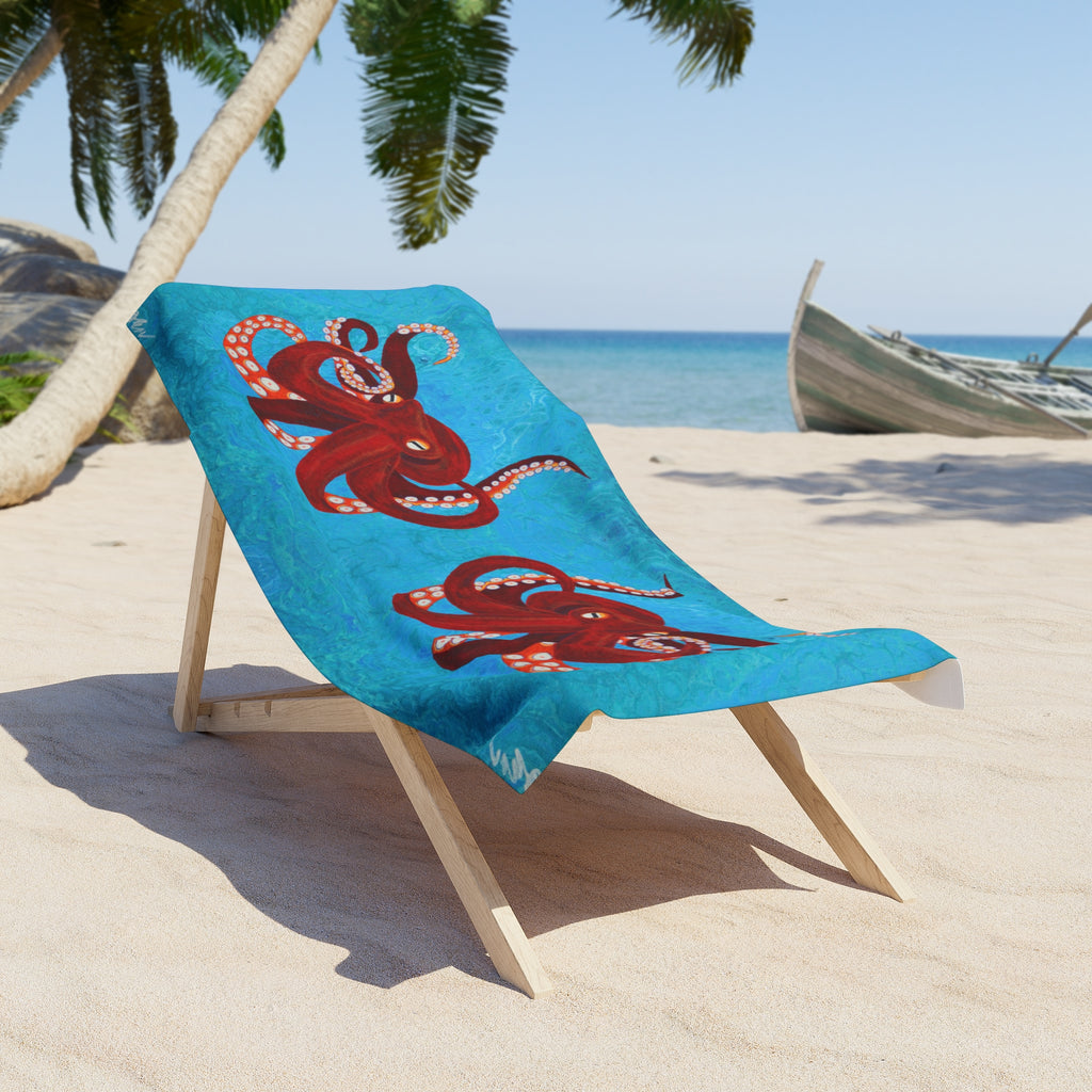 Beach towel/blanket with octopus design on a wooden chair at the beach
