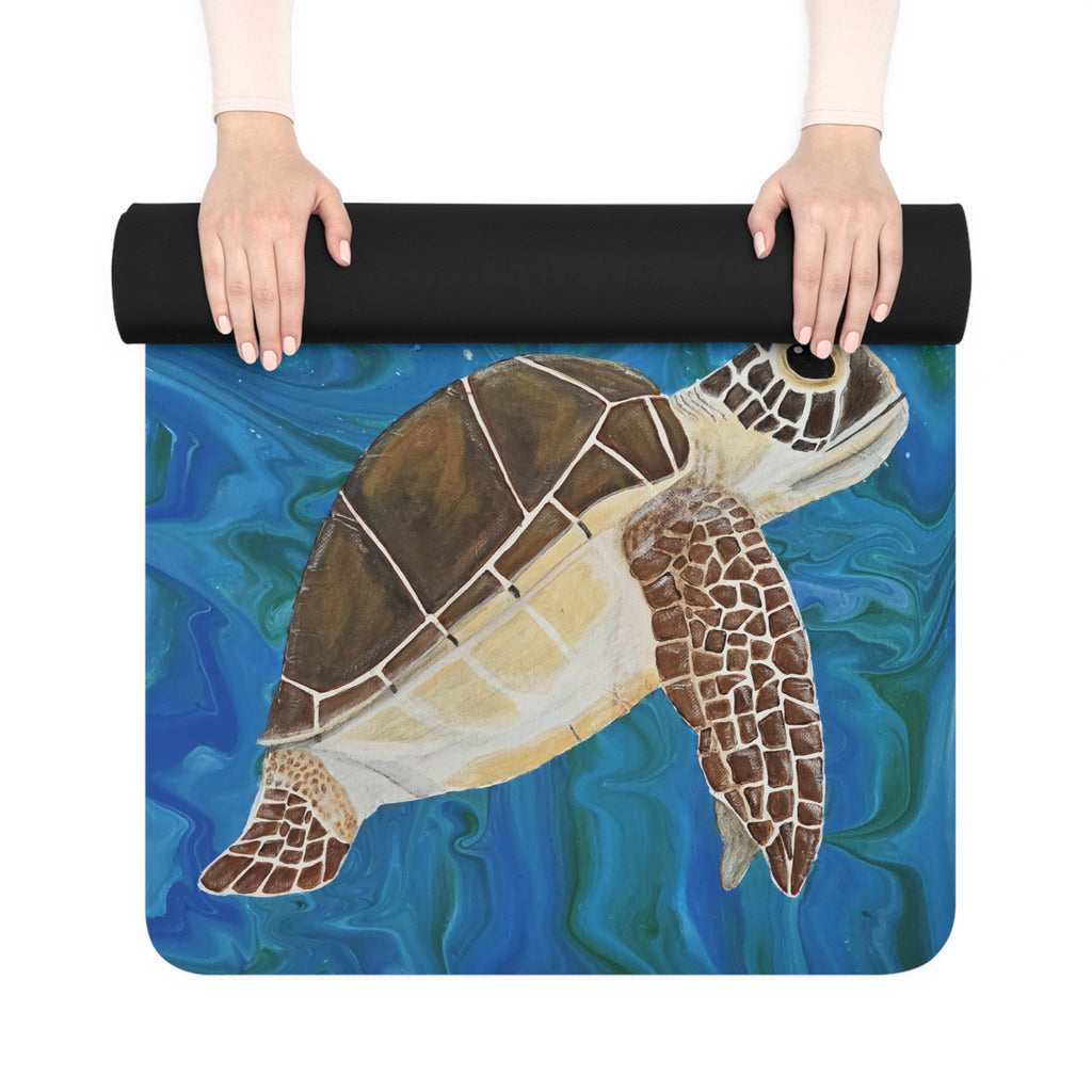 Yoga mat with a turtle design held by hands on a white background
