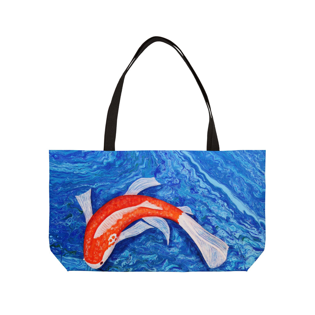 Tote bag with a design of a red and white fish on a blue water background