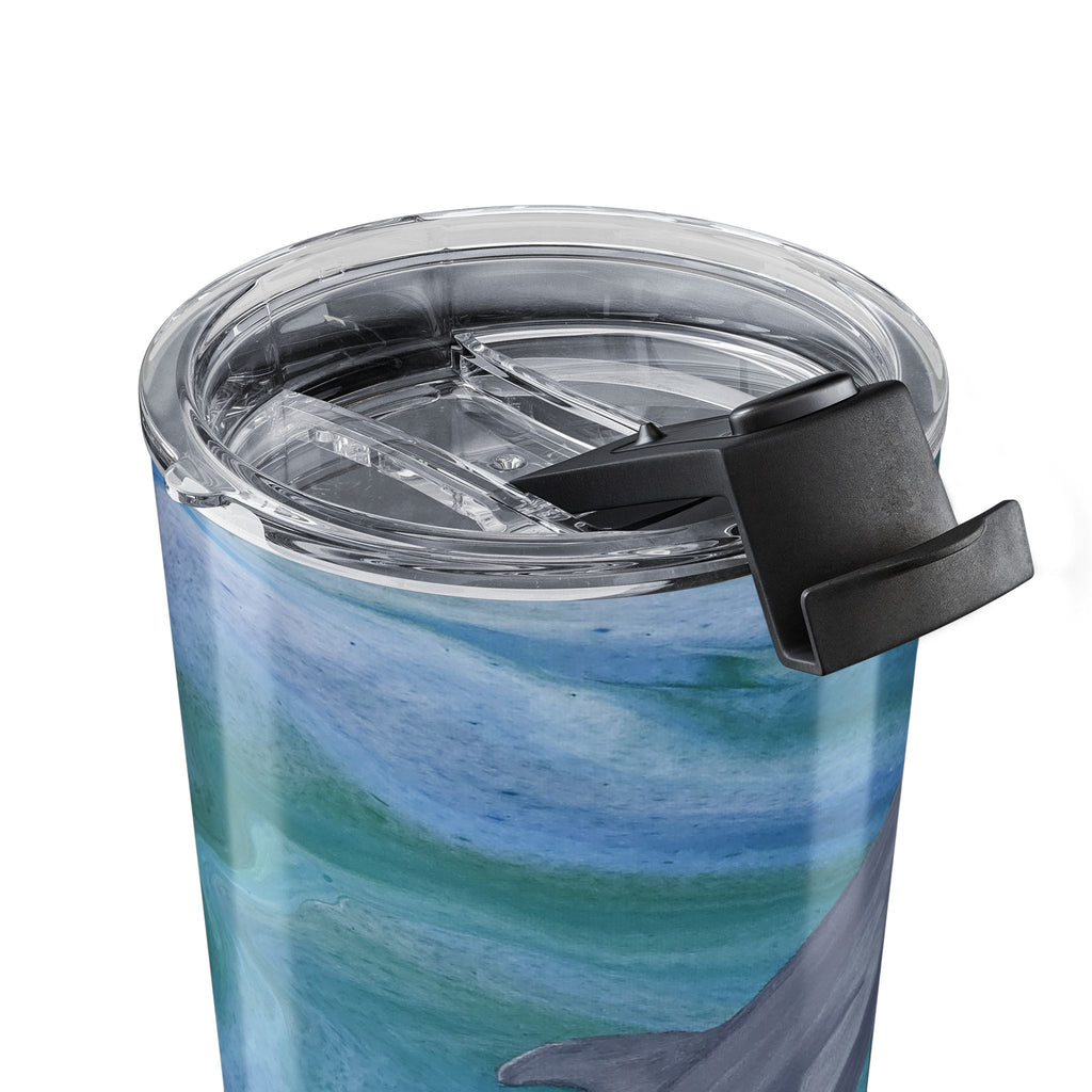 Tumbler with a dolphin design and clear lid on a white background