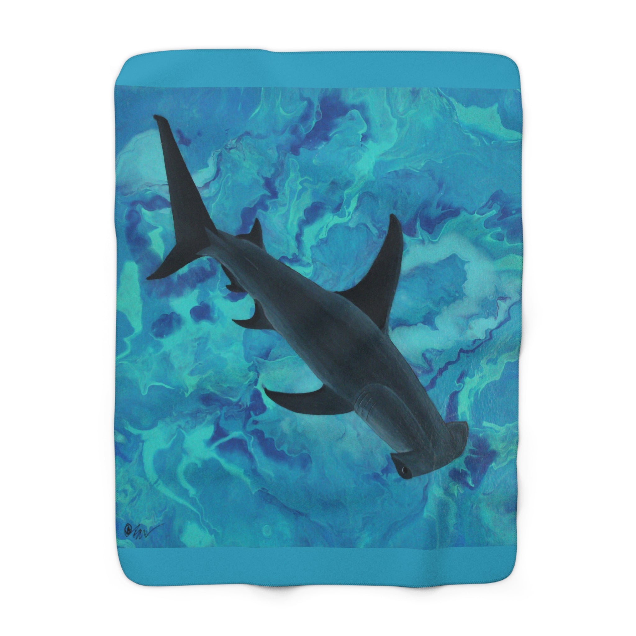 Blanket with a shark design on a blue and green abstract pattern background