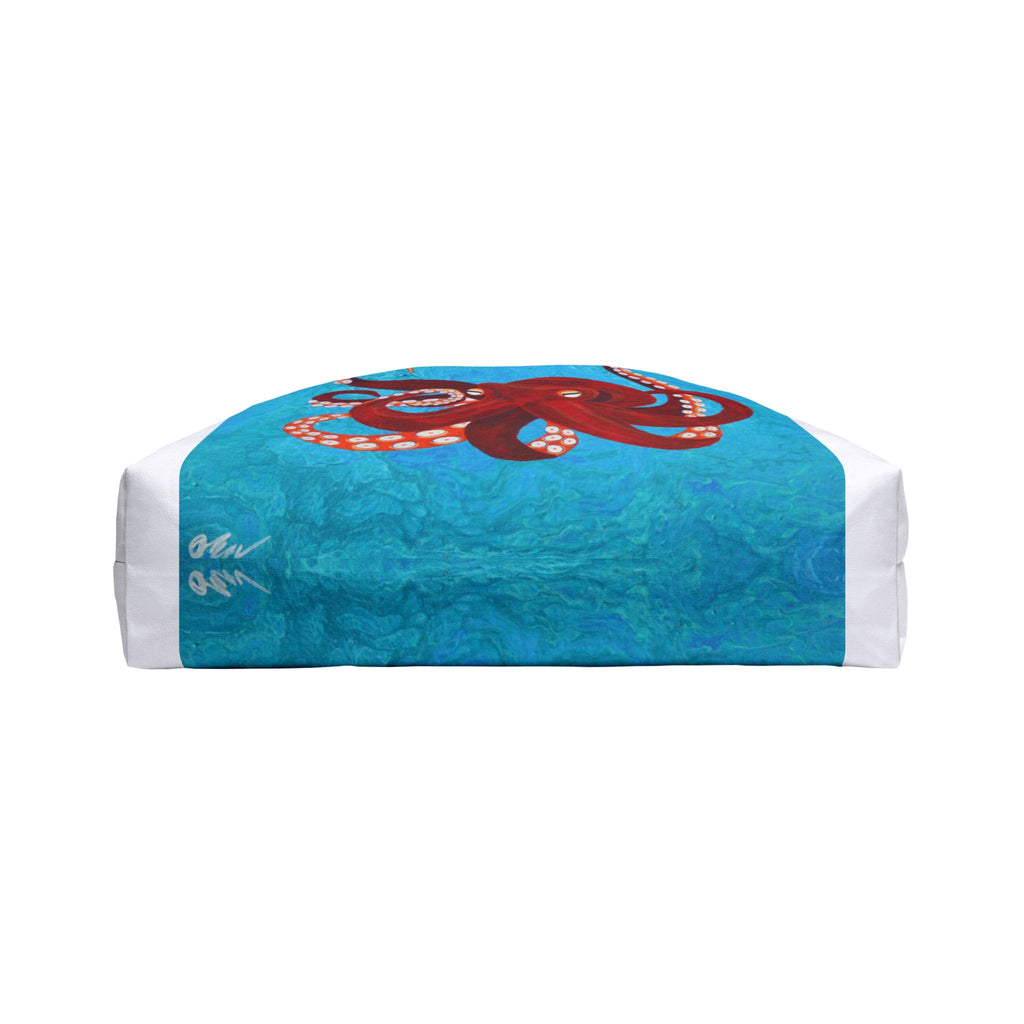 Bottom of bag with a red octopus design on a white background
