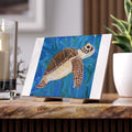 Artistic depiction of a turtle on a blue background, tile displayed on a stand.