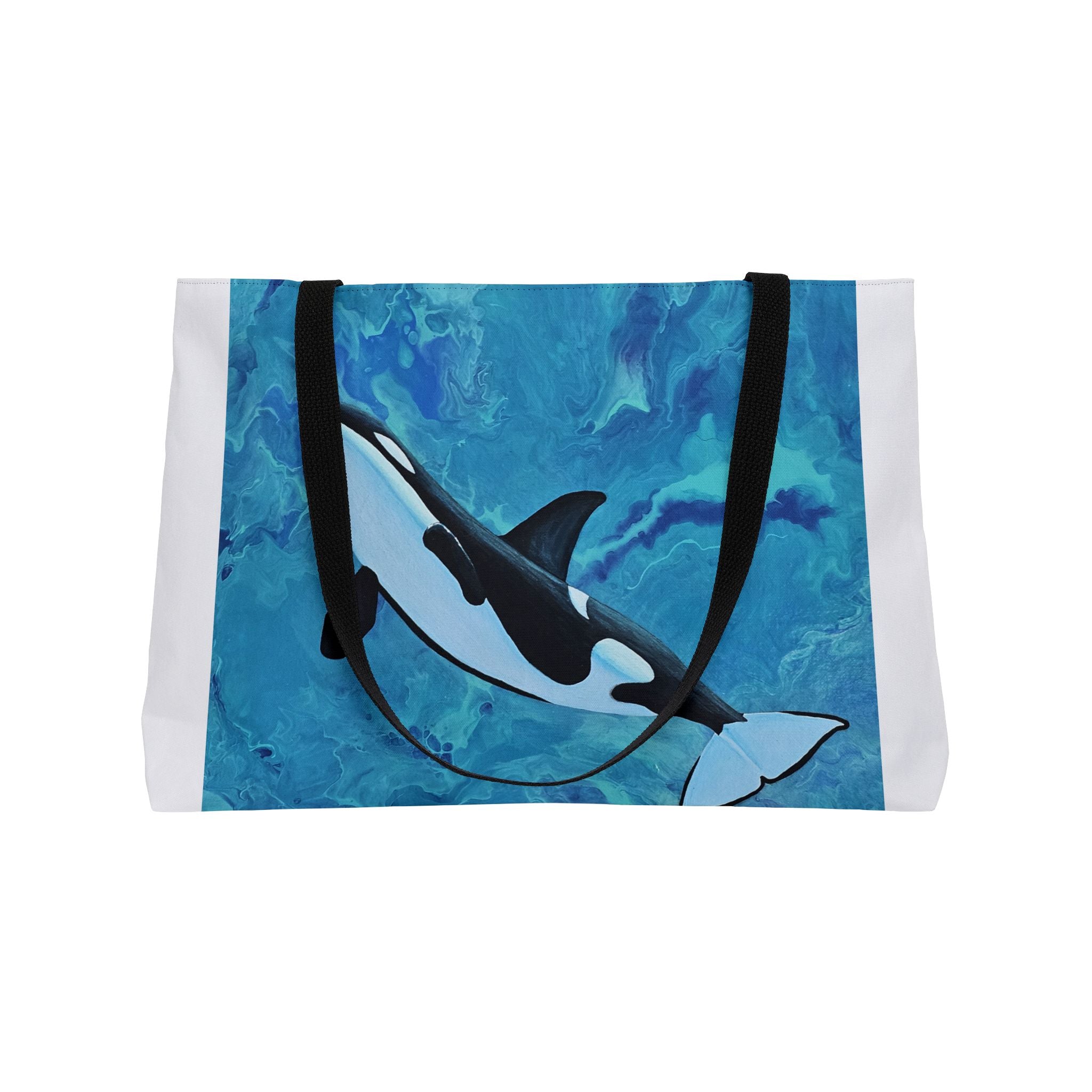 Tote bag with an orca whale design on a blue watercolor background