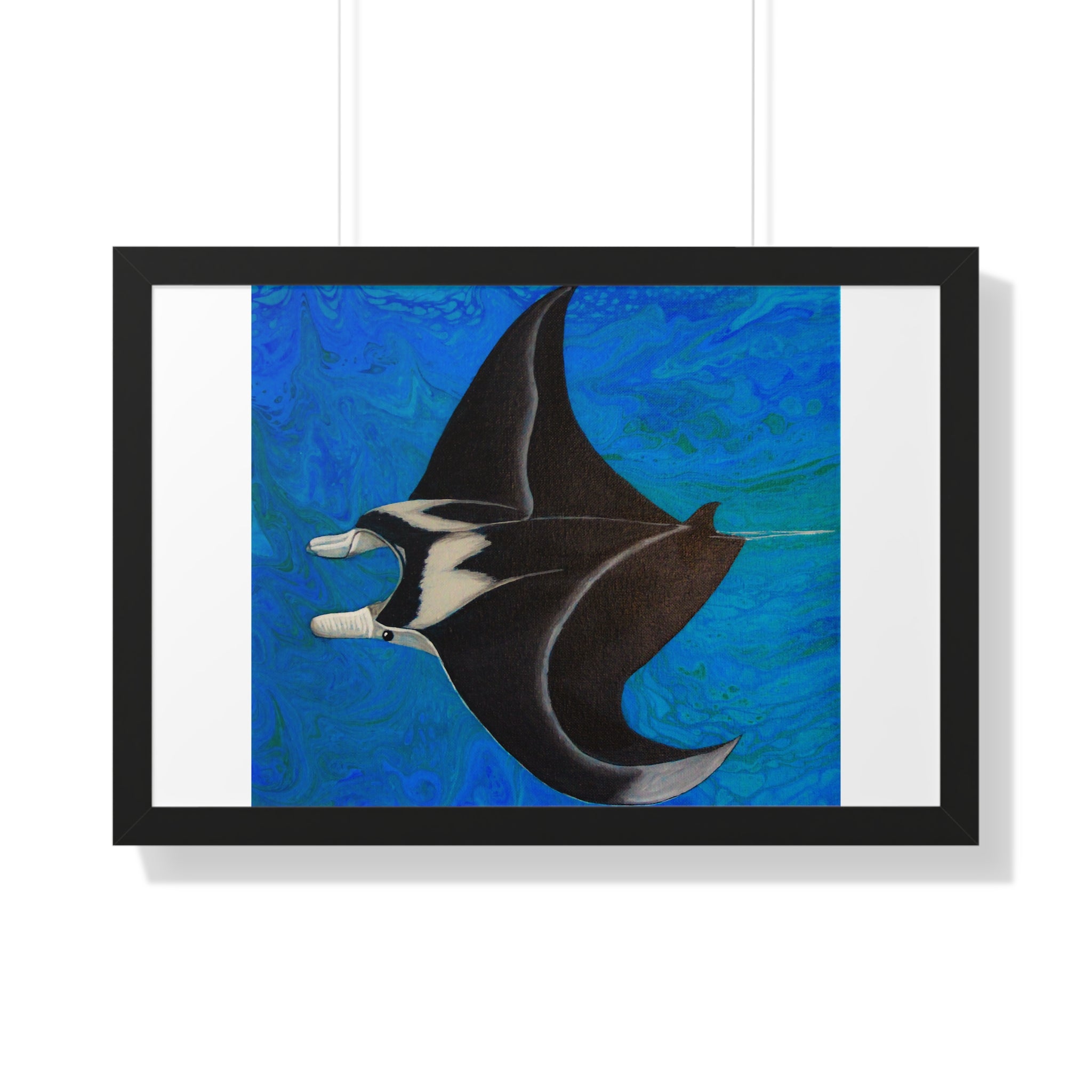 Framed artwork of a manta ray on a blue background
