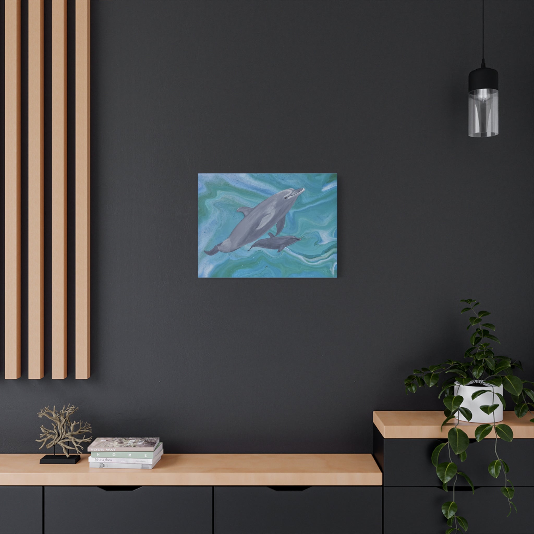 Framed artwork of a dolphin on a dark wall with wooden shelves and decor.