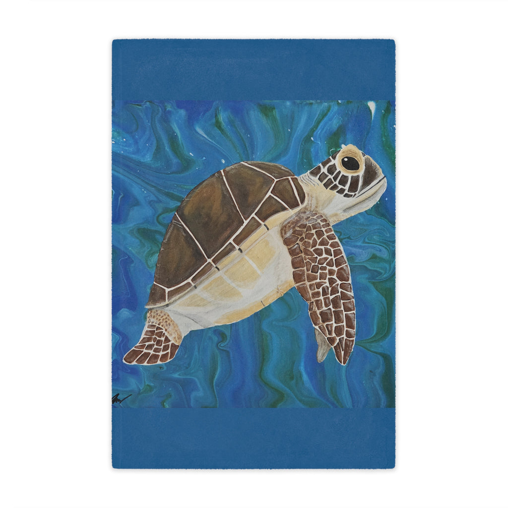Blanket with a turtle illustration on a blue water background