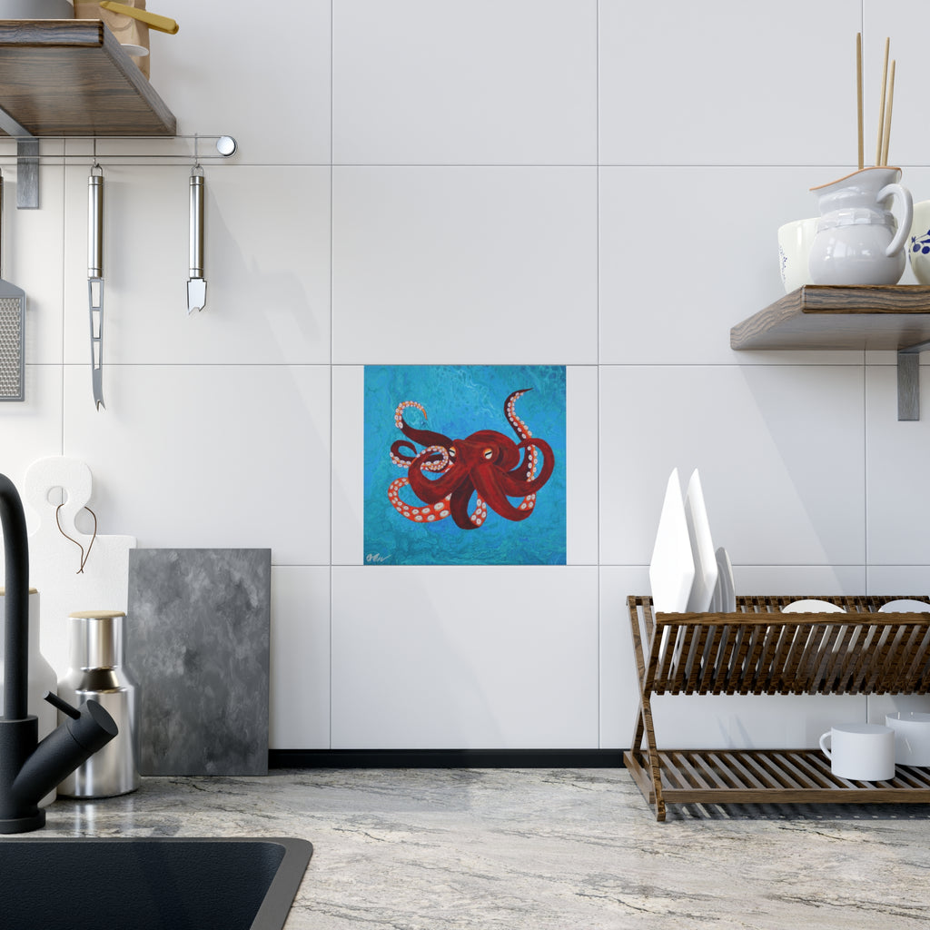 Kitchen interior with a red octopus artwork on a white tiled wall.