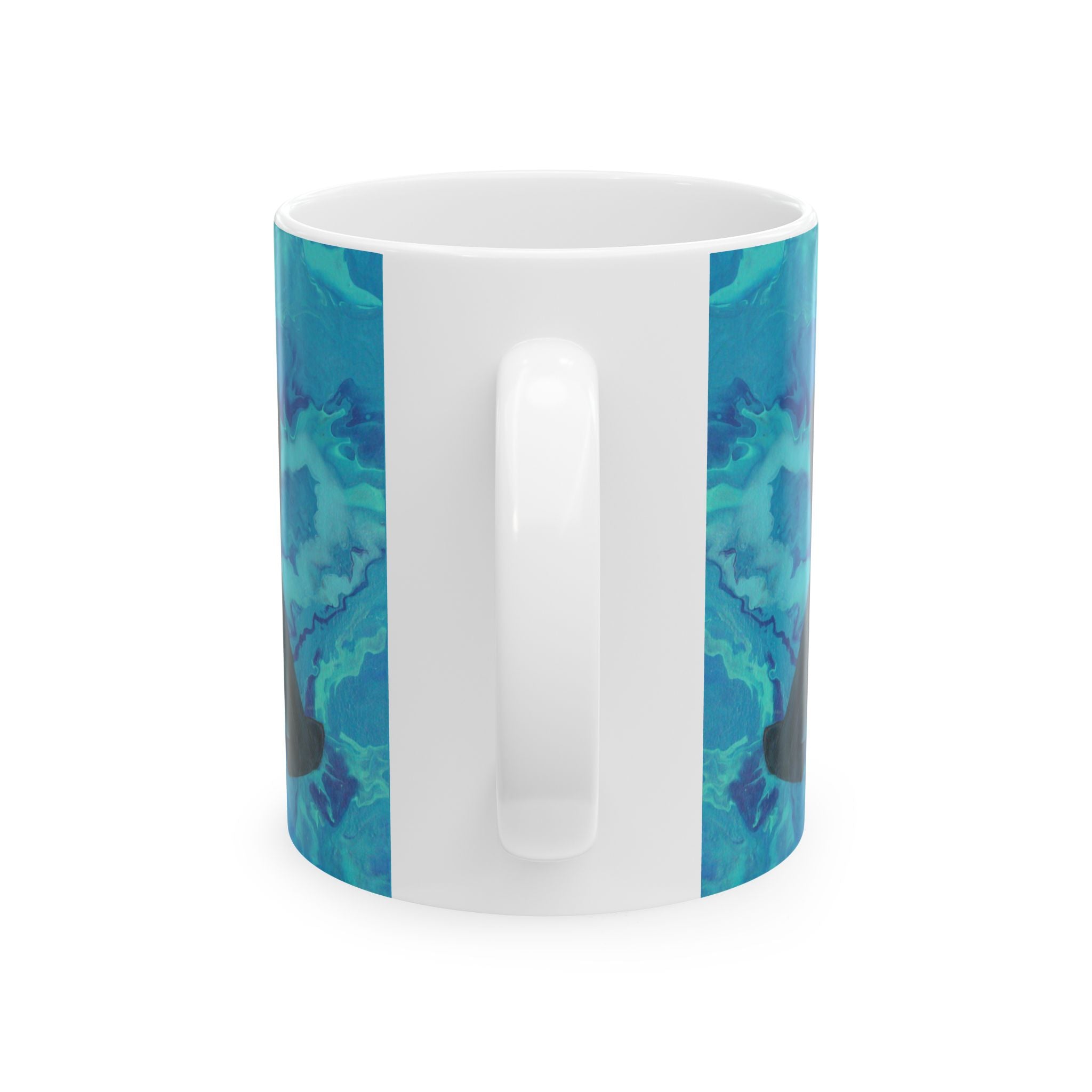 White mug with blue and green abstract pattern on a white background