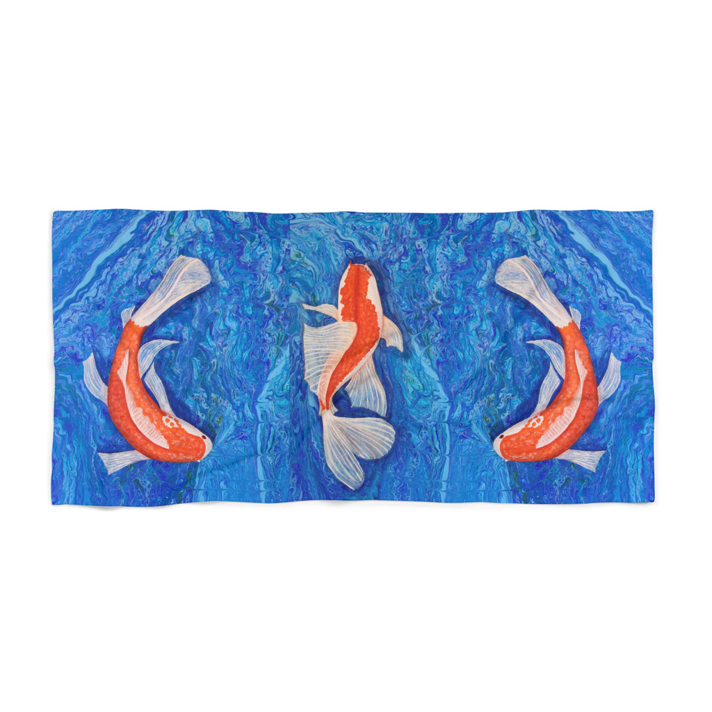 Towel/blanket with koi fish design on a blue water pattern