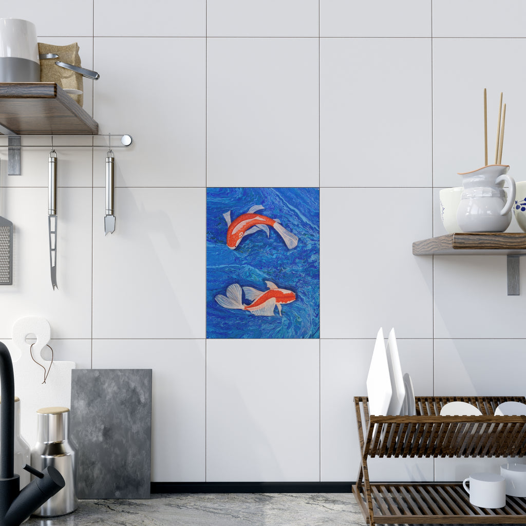 Kitchen interior with a tile featuring two fish designs.