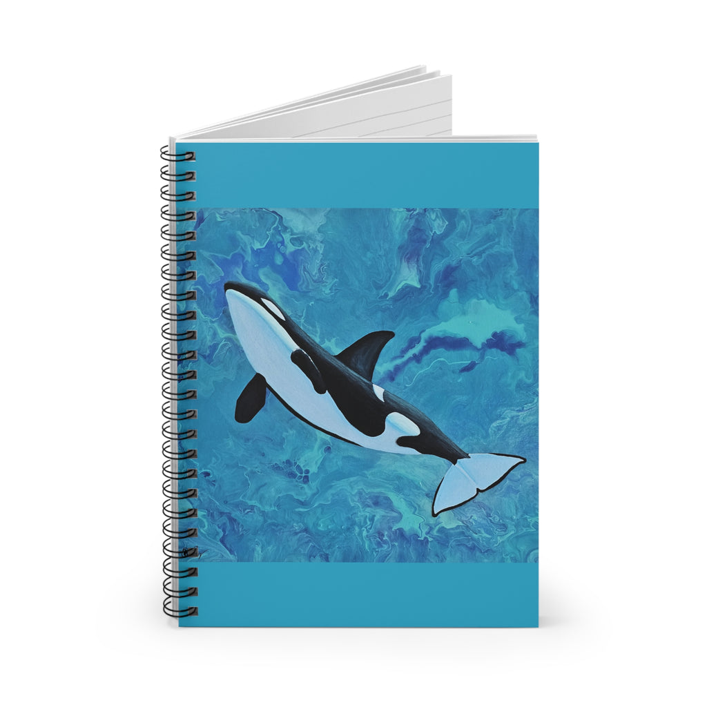Notebook with an orca whale design on a blue watercolor background