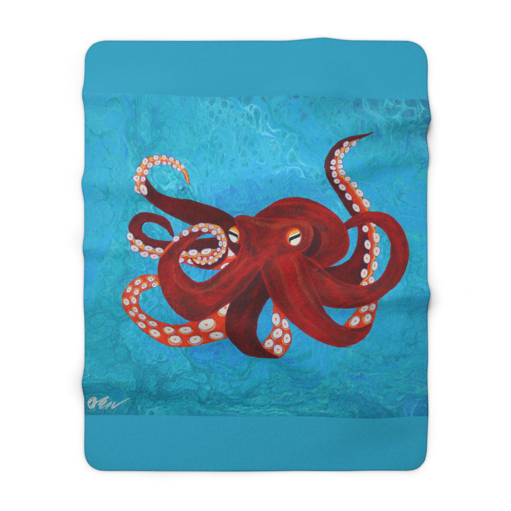 Blanket with a red octopus design on a blue background