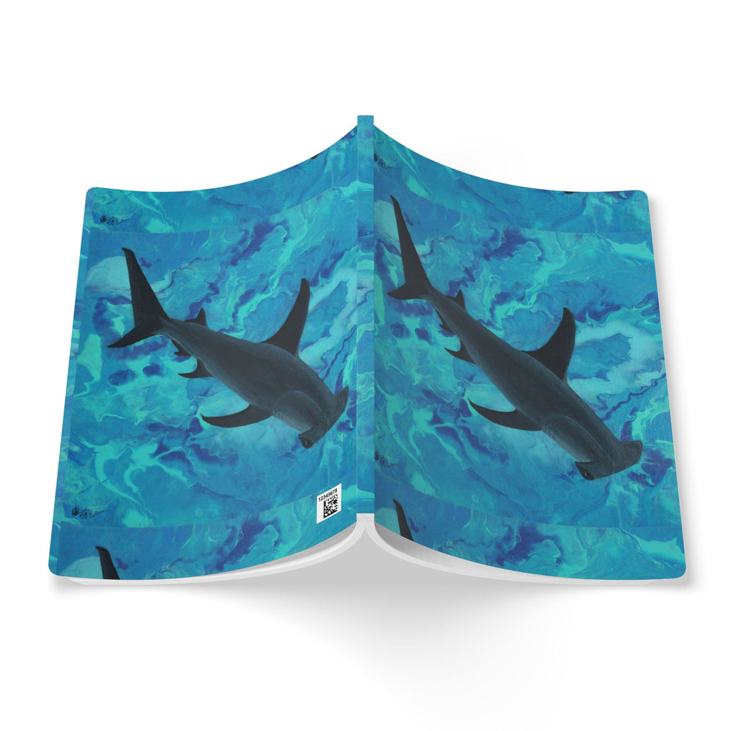 Open Notebook with shark design on a blue water pattern