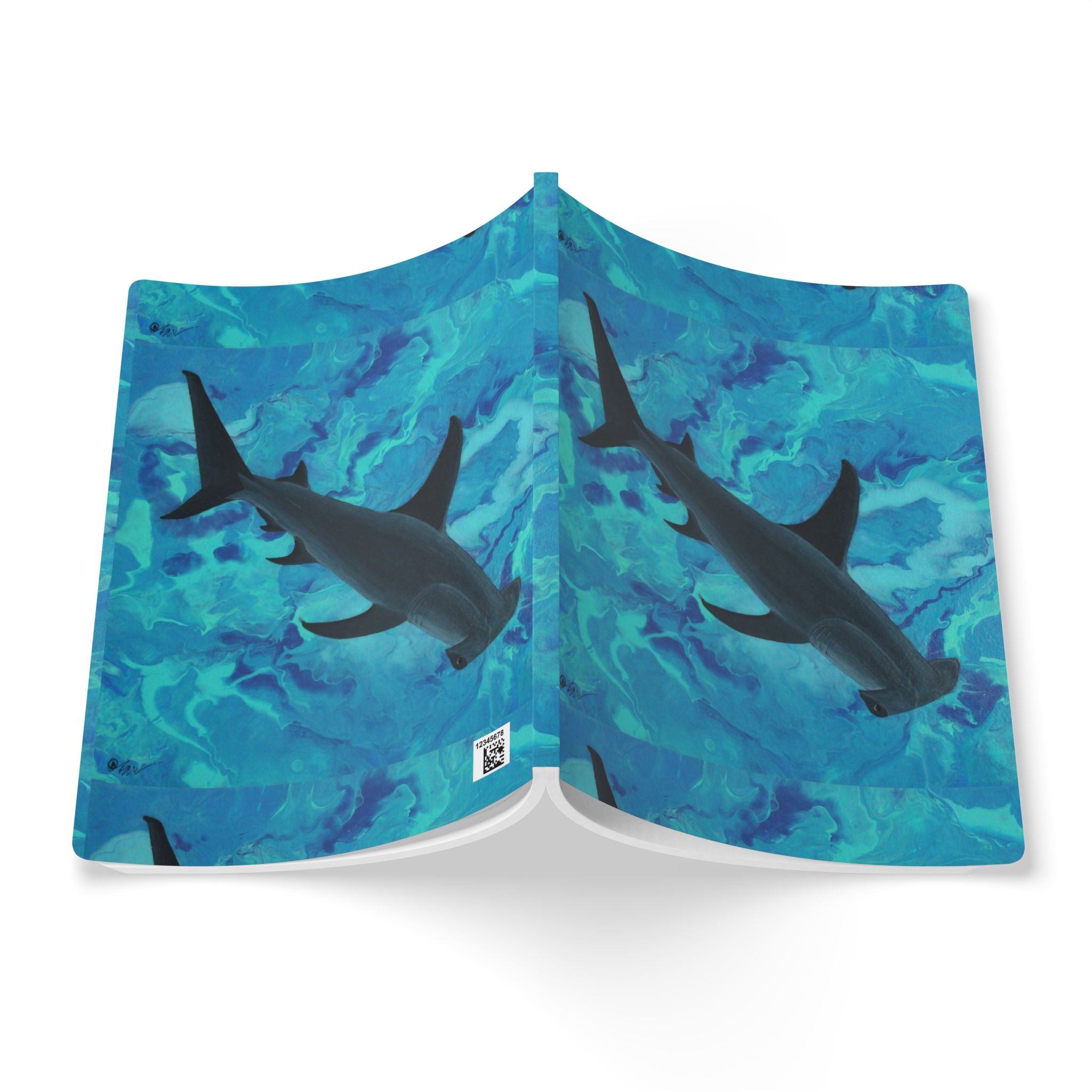 Open Notebook with shark design on a blue water pattern