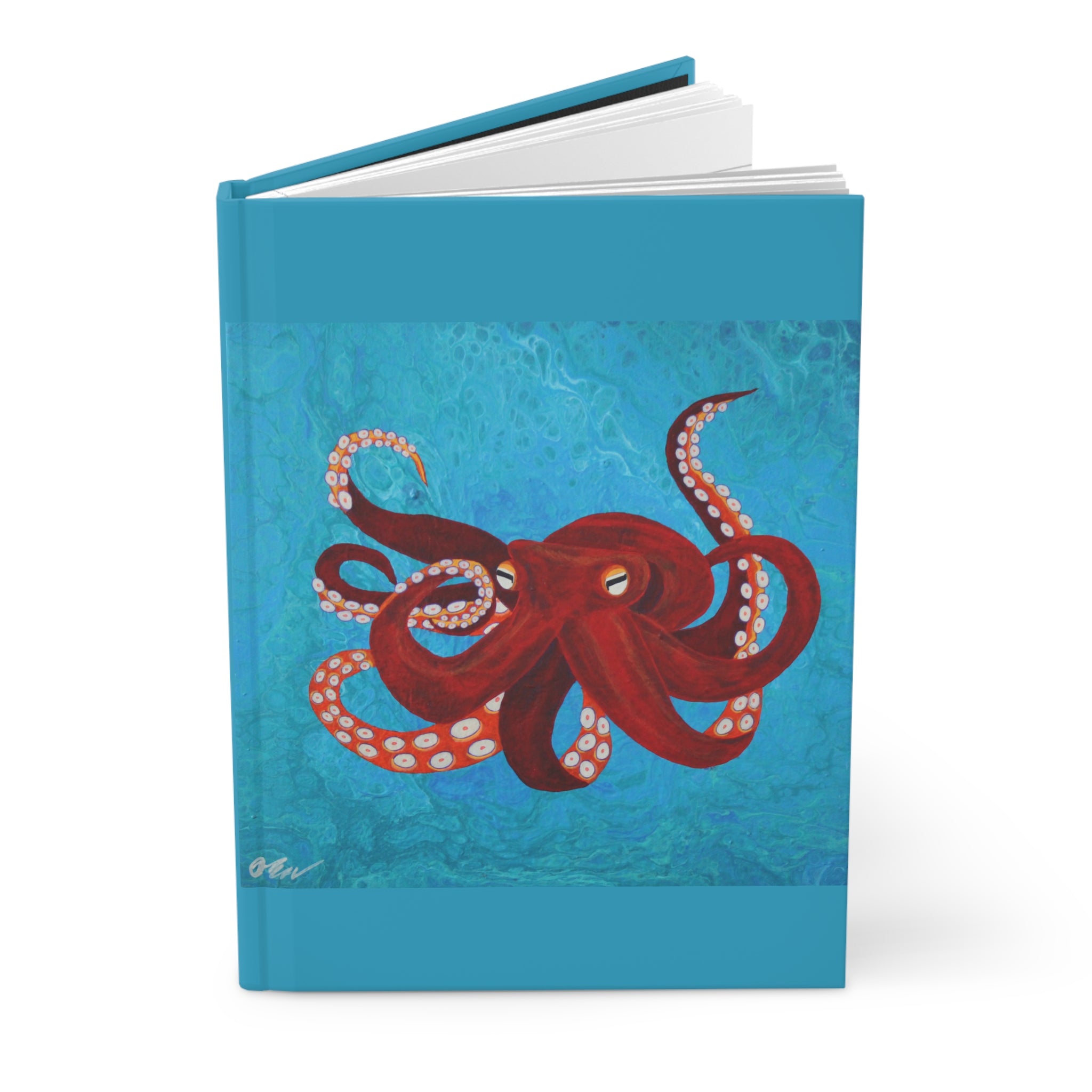 Notebook with a red octopus design on a blue textured background