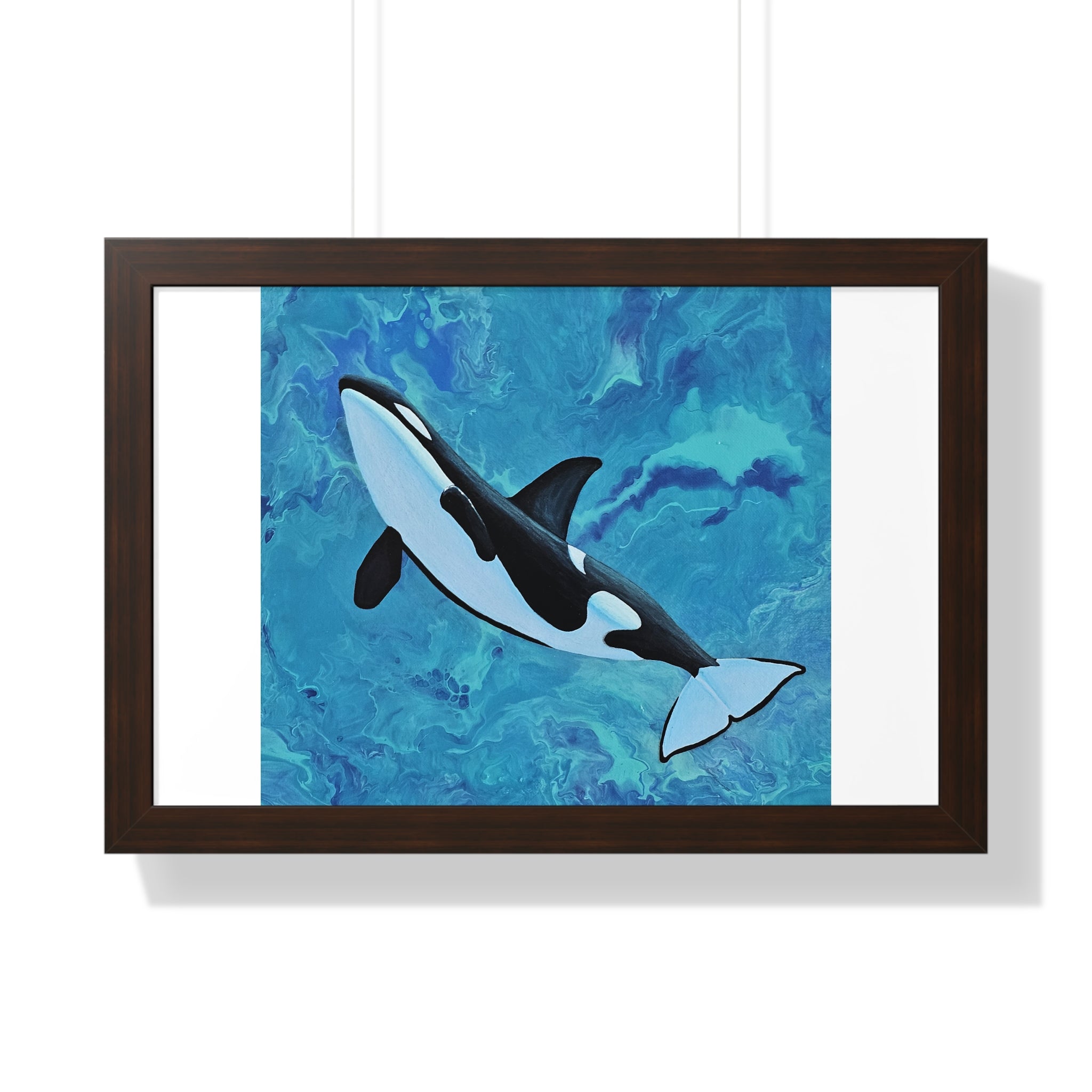 Framed artwork of an orca whale on a blue watercolor background