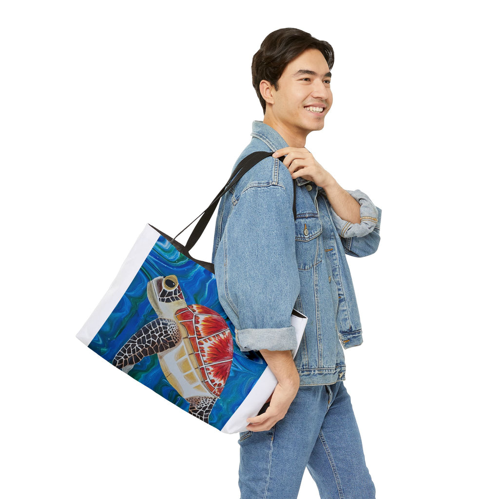 Man carrying a tote bag with a turtle design on a white background