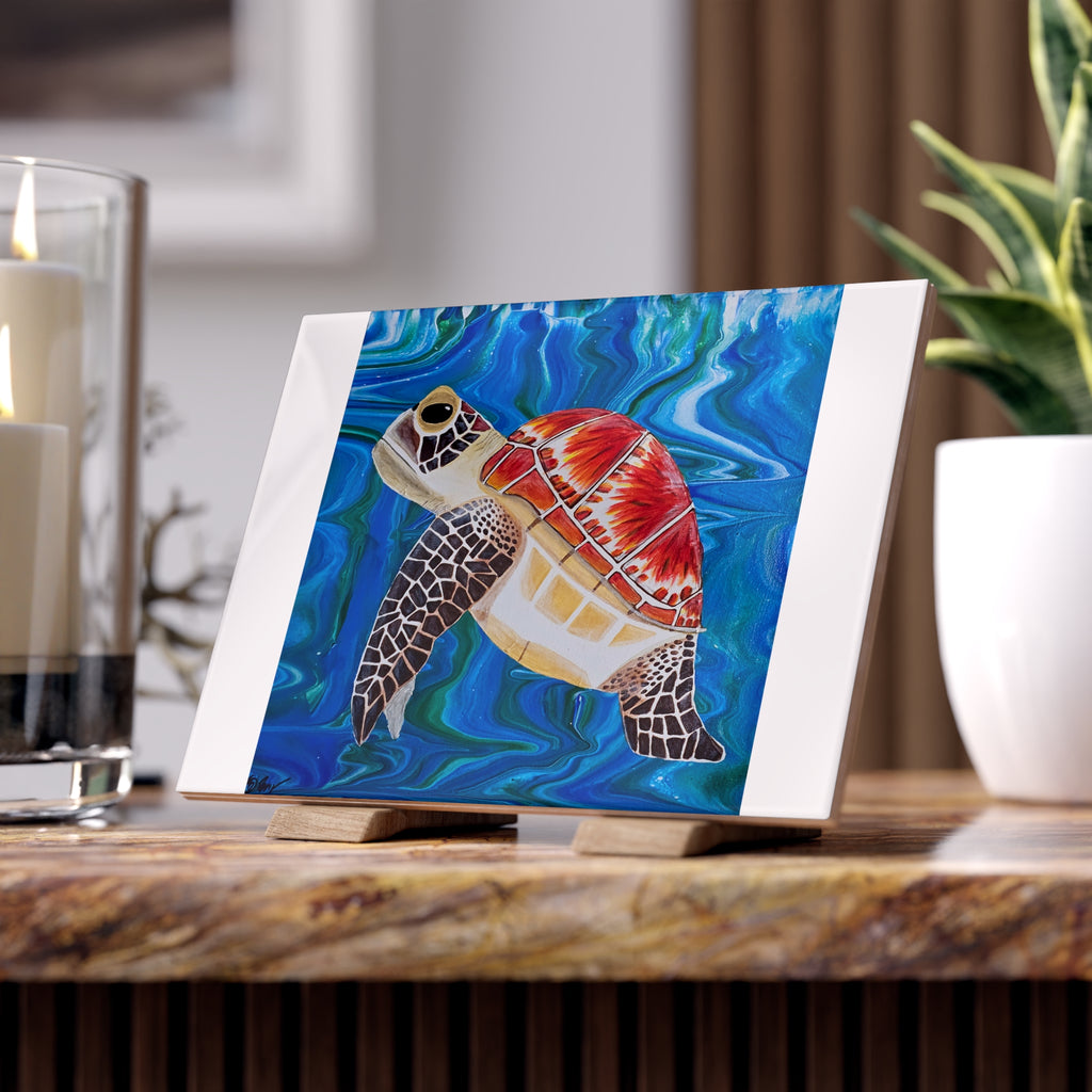 Colorful turtle painting on tile with a stand with candles and a plant in the background