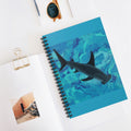 Notebook with a shark design on a white surface