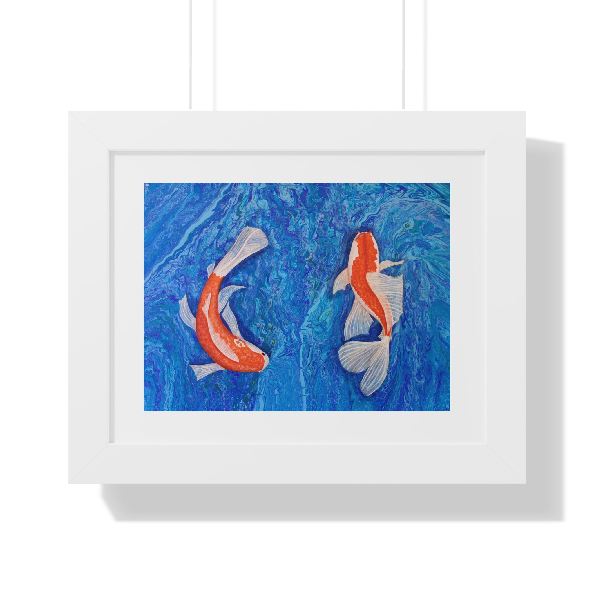 Framed artwork of two koi fish on a blue background