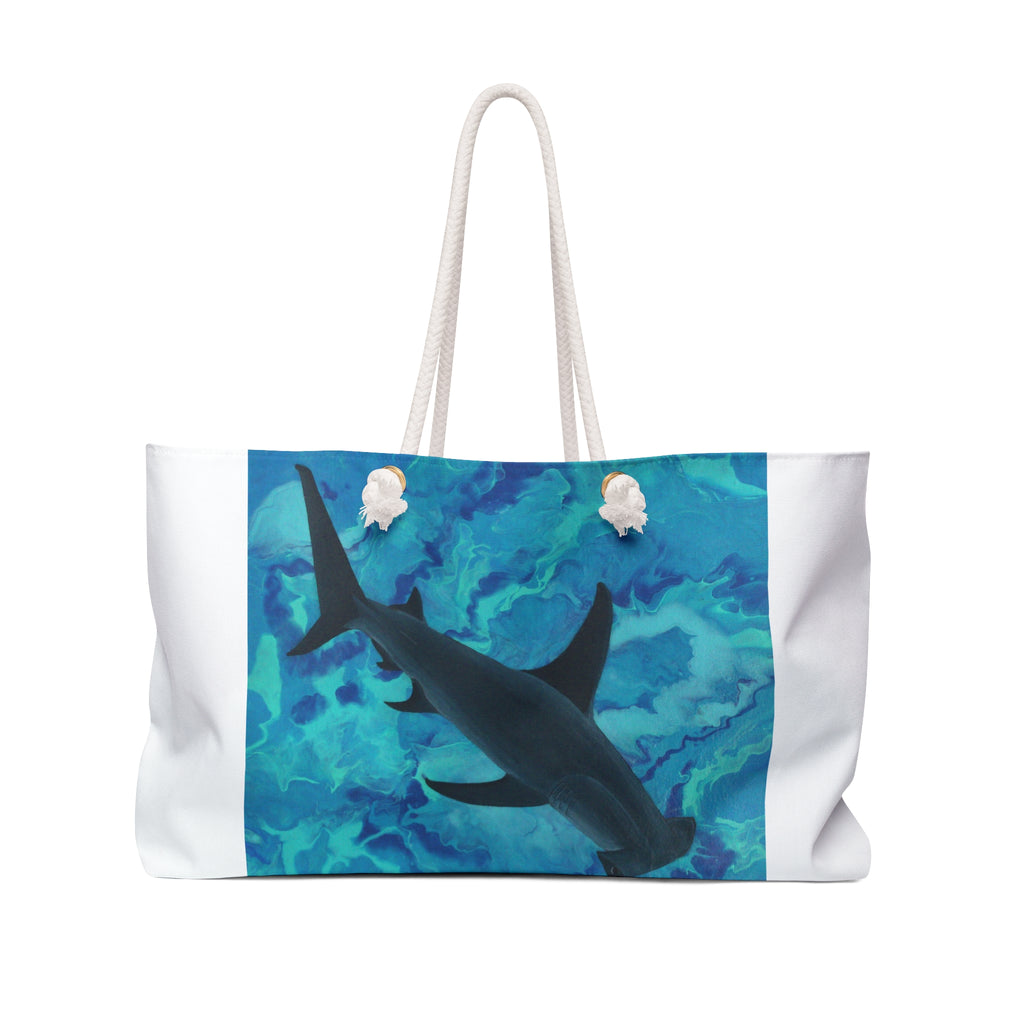 Tote bag with a shark design on a blue and green watercolor background