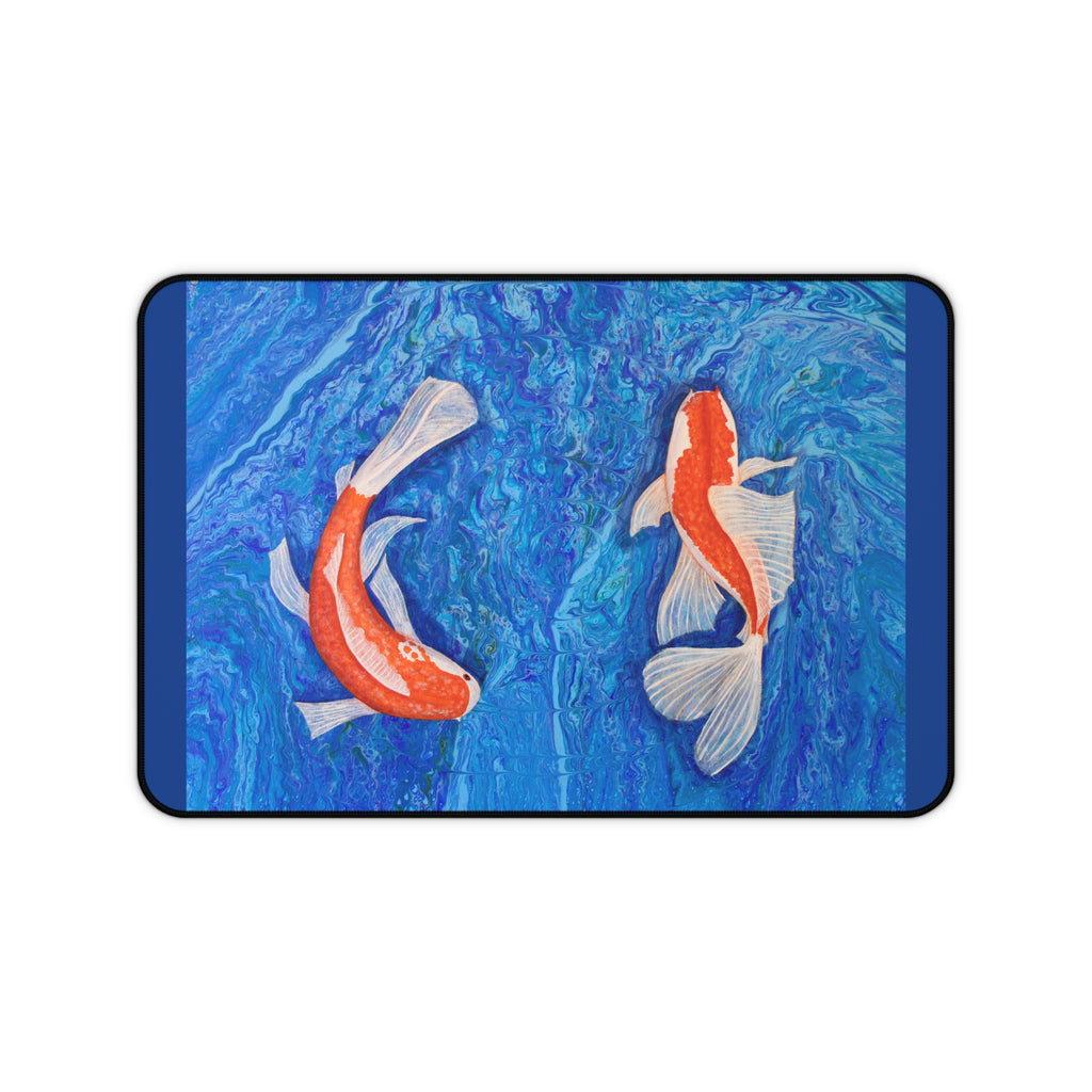 Desk mat with two koi fish design on a blue water background