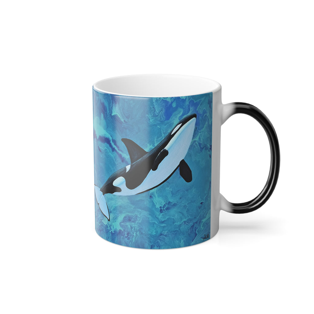Mug with an orca whale design on a blue watercolor background