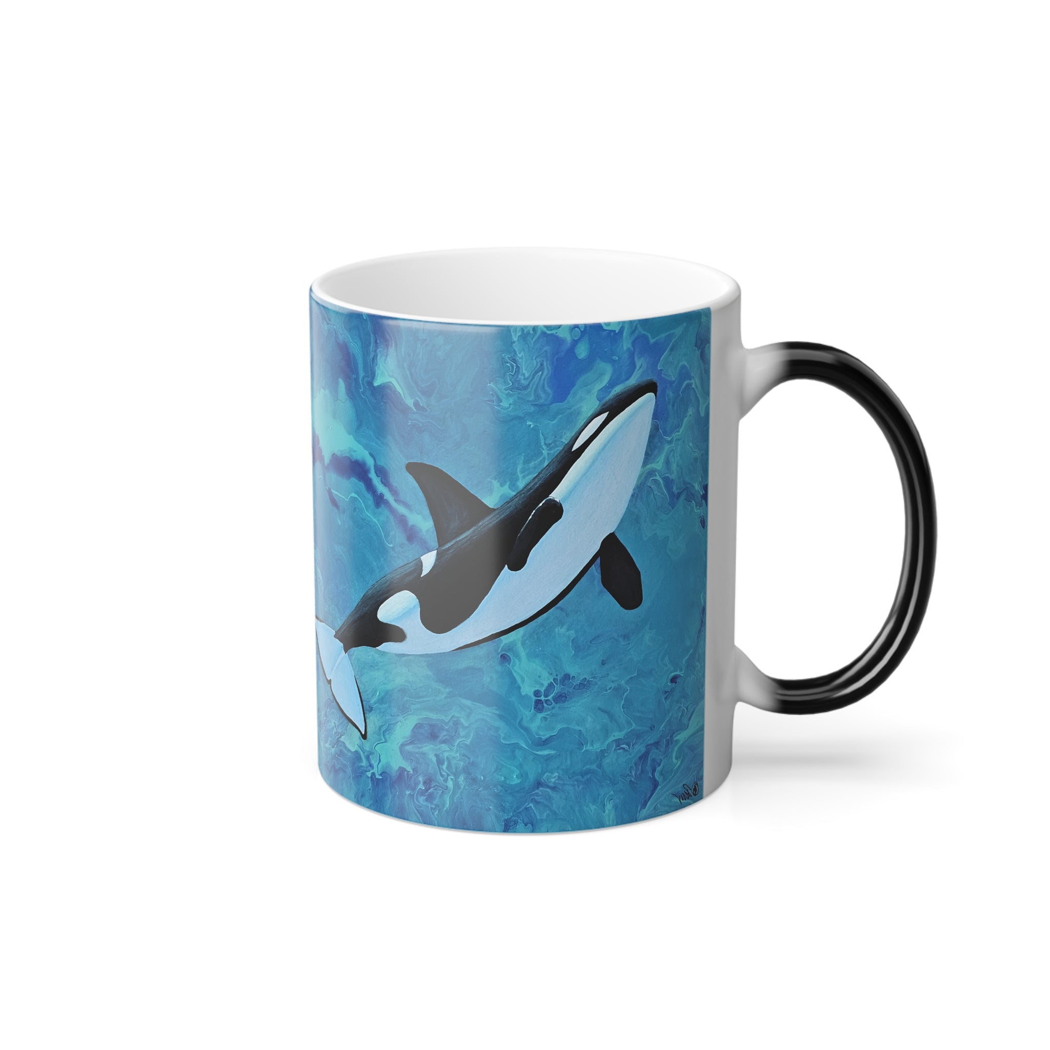 Mug with an orca whale design on a blue watercolor background