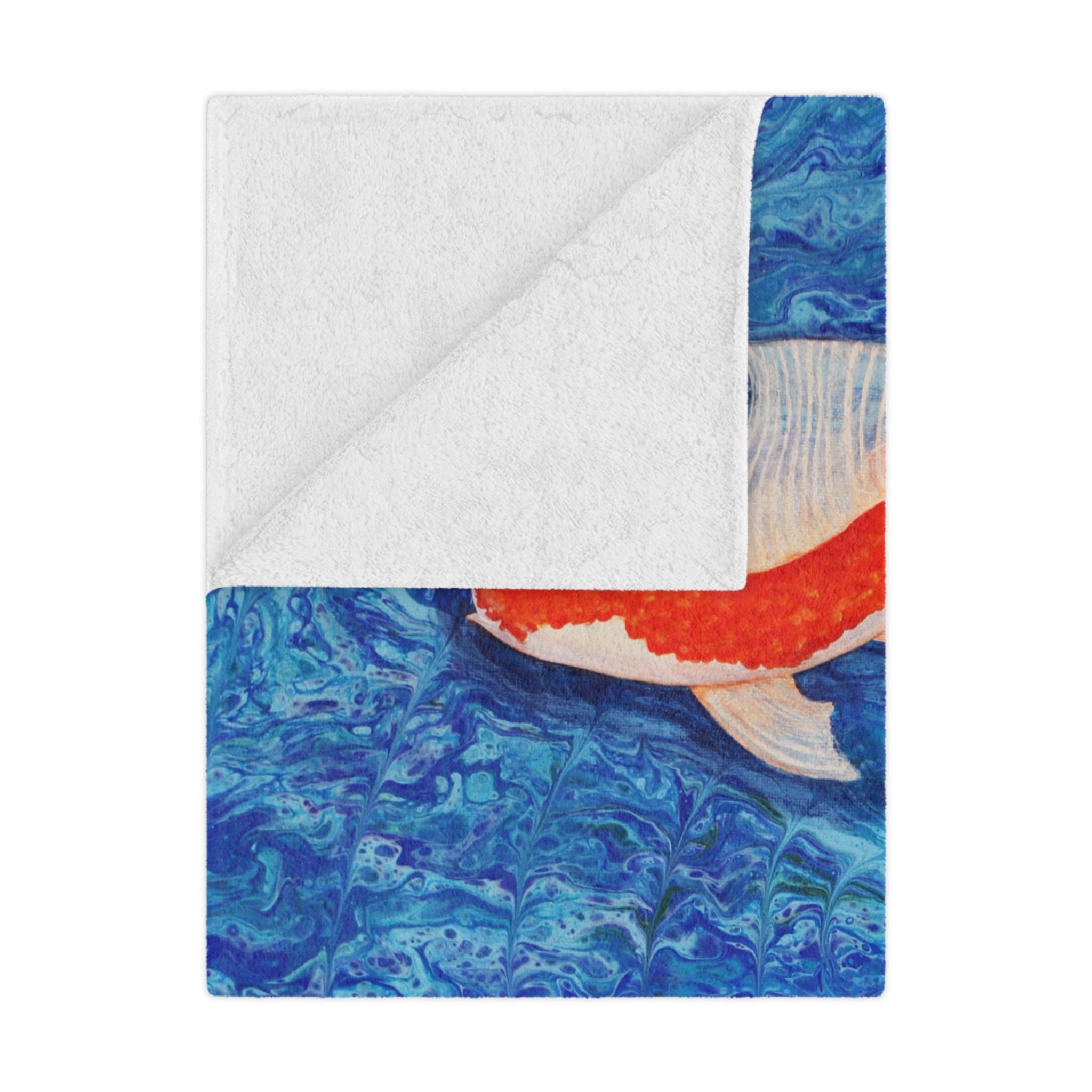 Blanket with a colorful fish design on a blue and white background