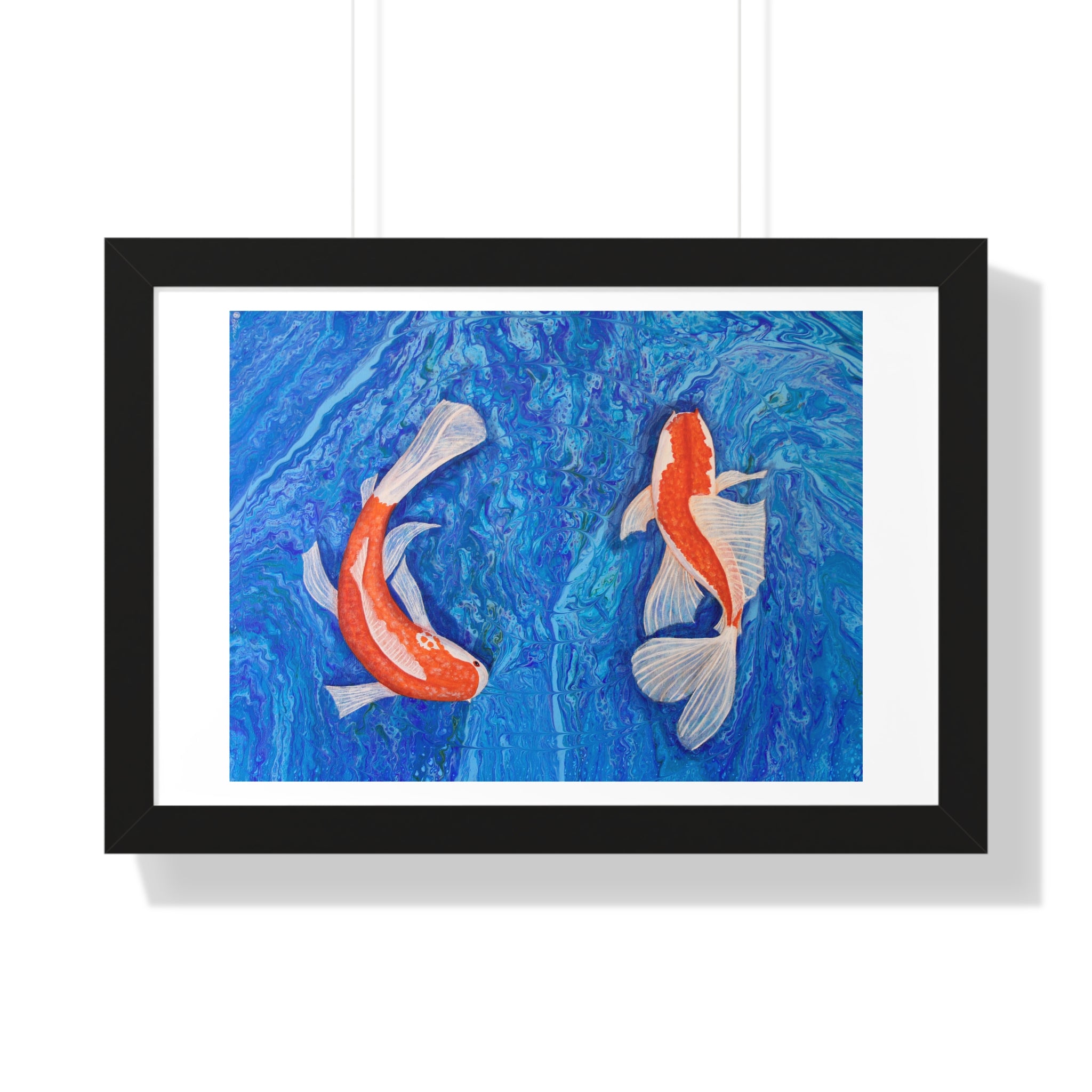 Framed artwork of two koi fish on a blue background