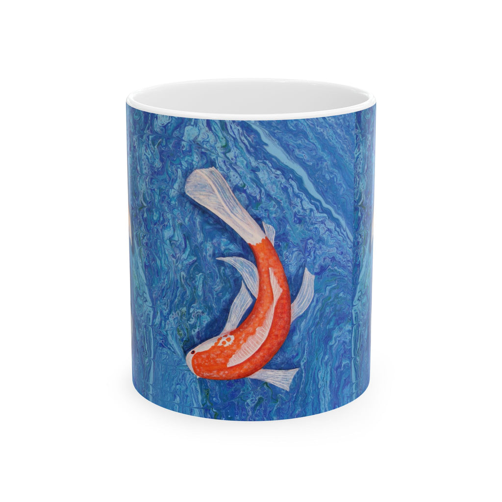 Mug with a design of two fish on a blue marbled background