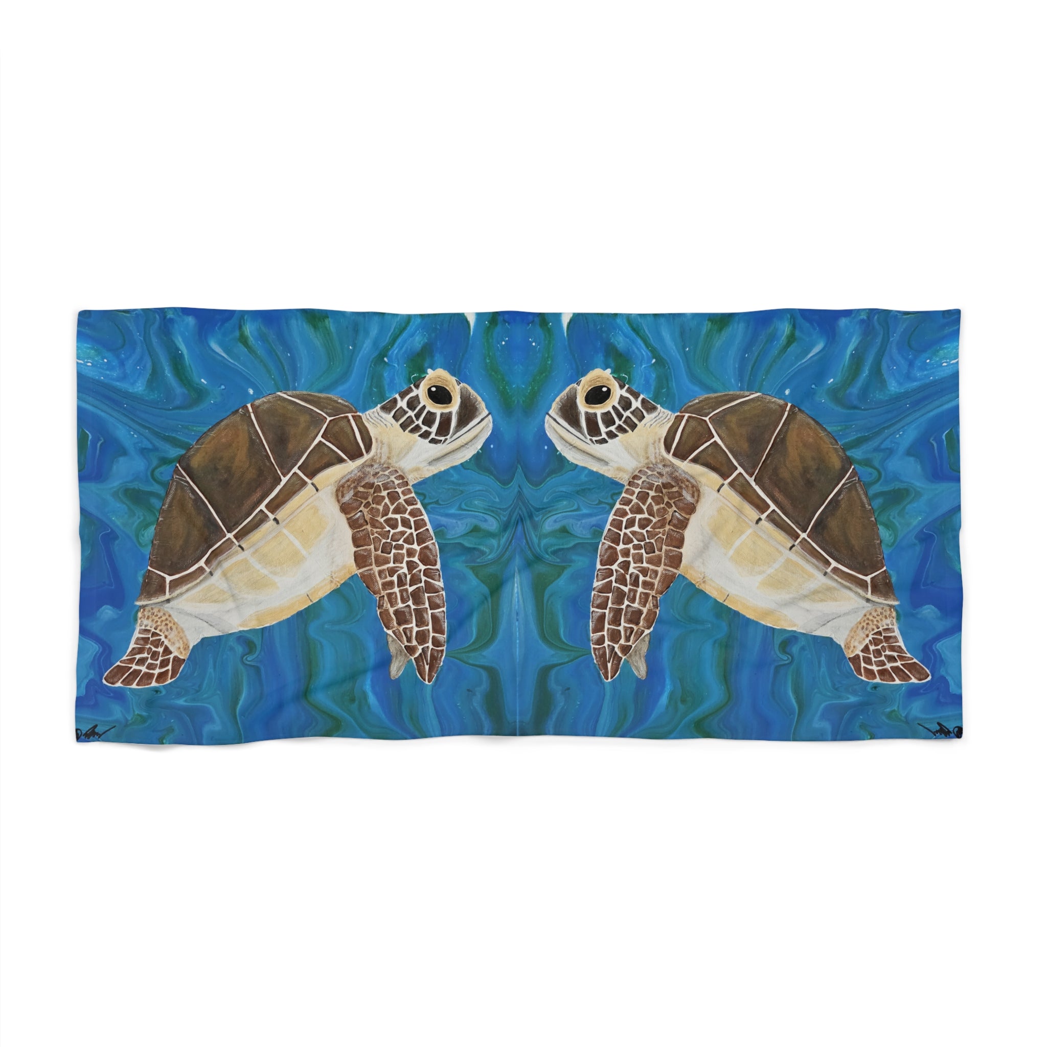 Towel/blanket with a design of two turtles on a blue water background