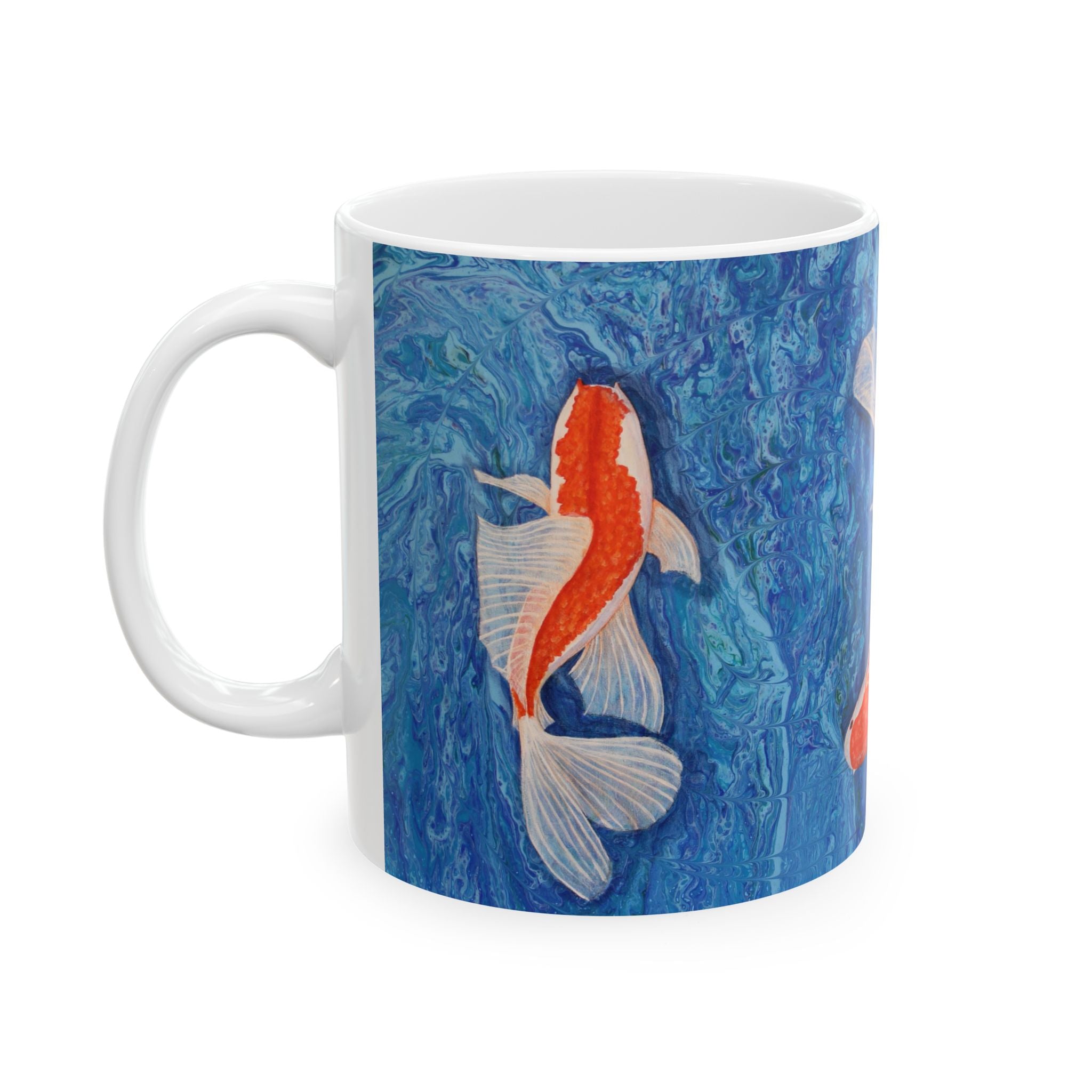 Mug with a koi fish design on a blue marbled background