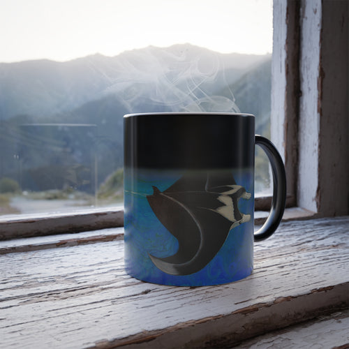 Mug with a shark design on a windowsill with a mountain view