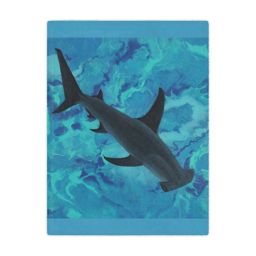 Hammerhead shark swimming in blue water on a blue background blanket