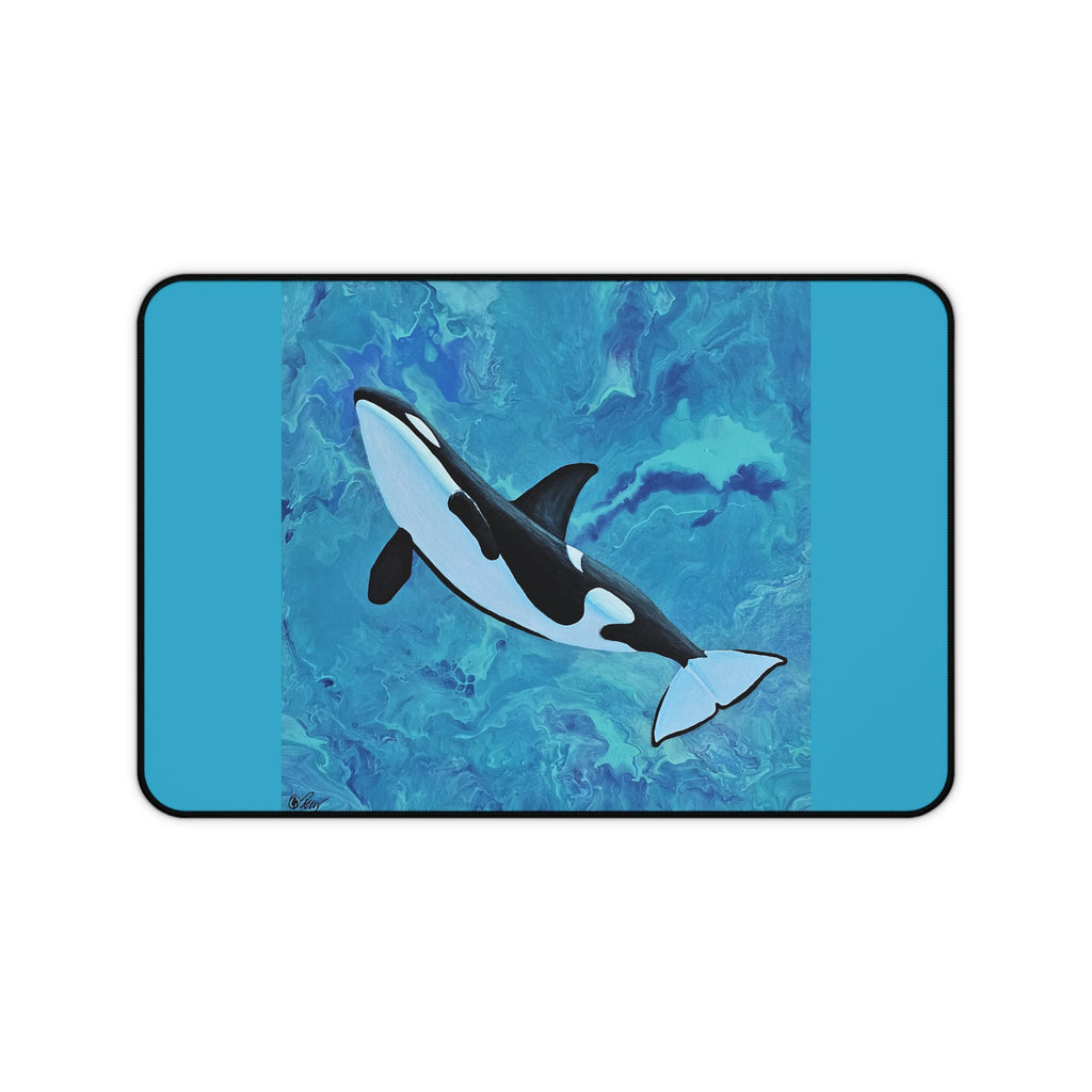 Orca whale design on a blue abstract background desk mat