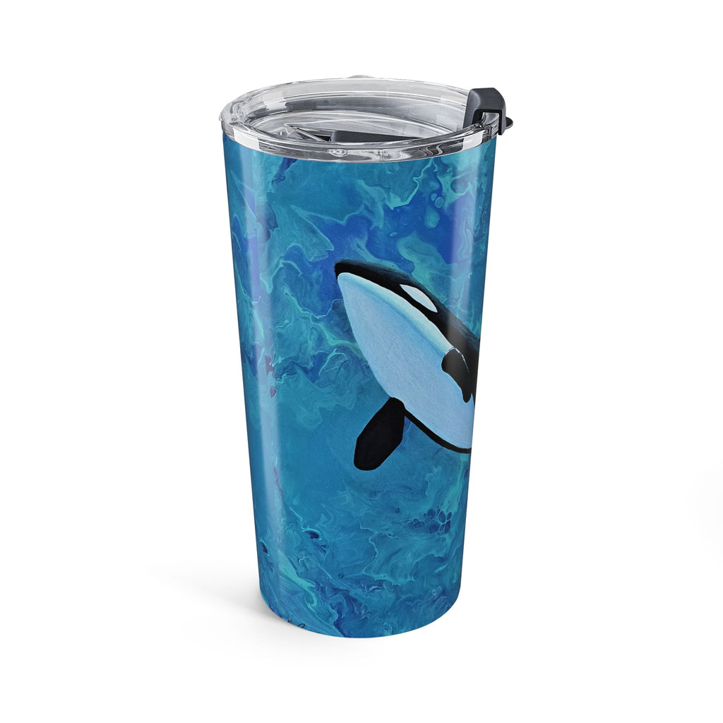 Tumbler with blue marbled design and orca whale illustration on a white background