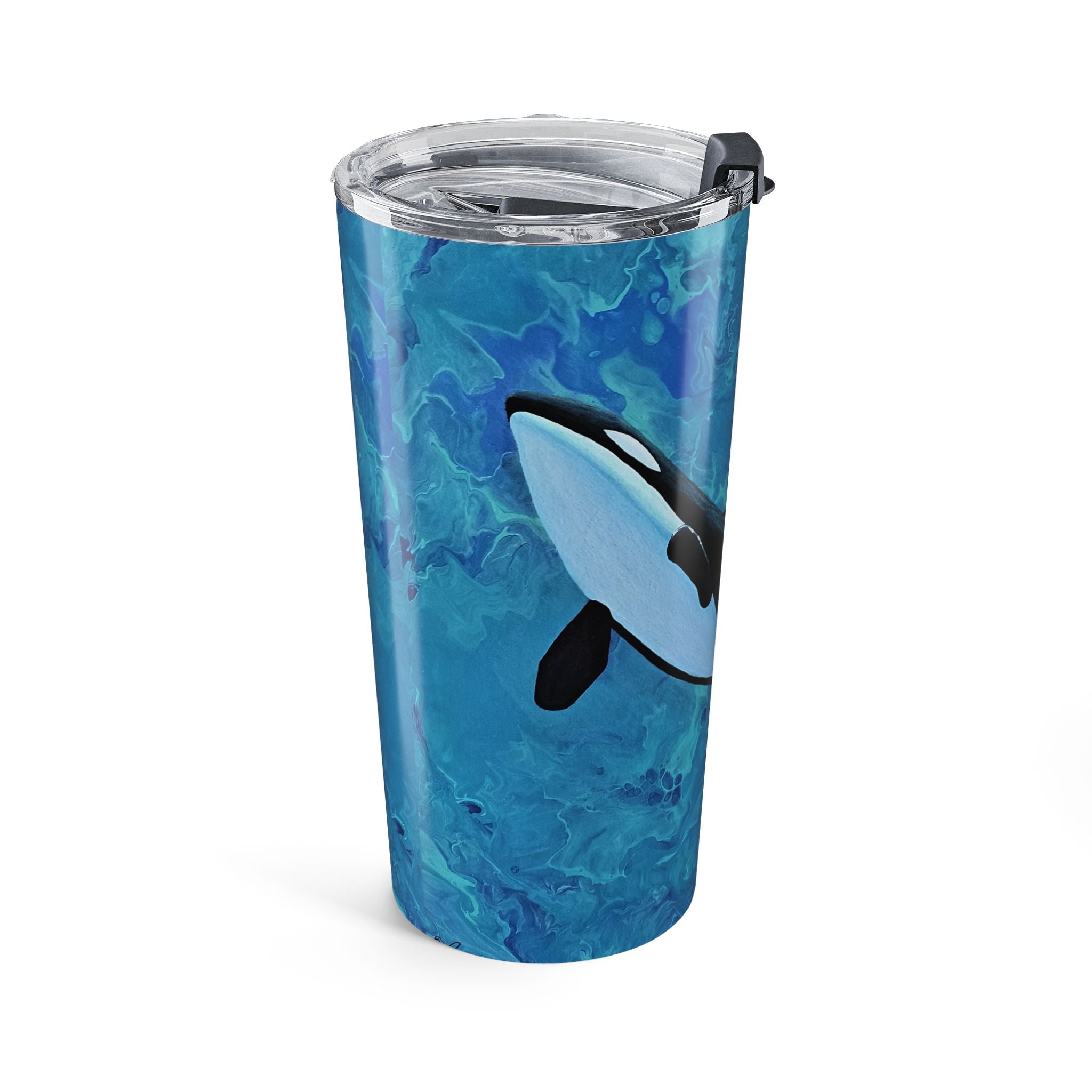 Tumbler with blue marbled design and orca whale illustration on a white background