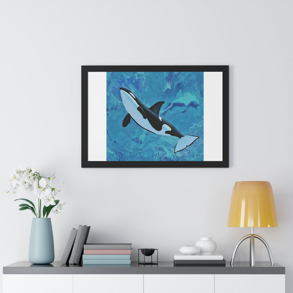 Framed artwork of a whale on a wall above a shelf with decor items.