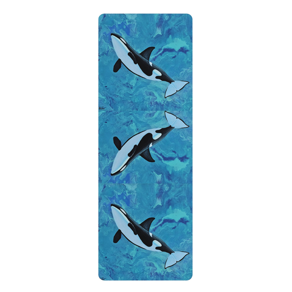 Yoga mat with orca whale design on a blue watercolor background