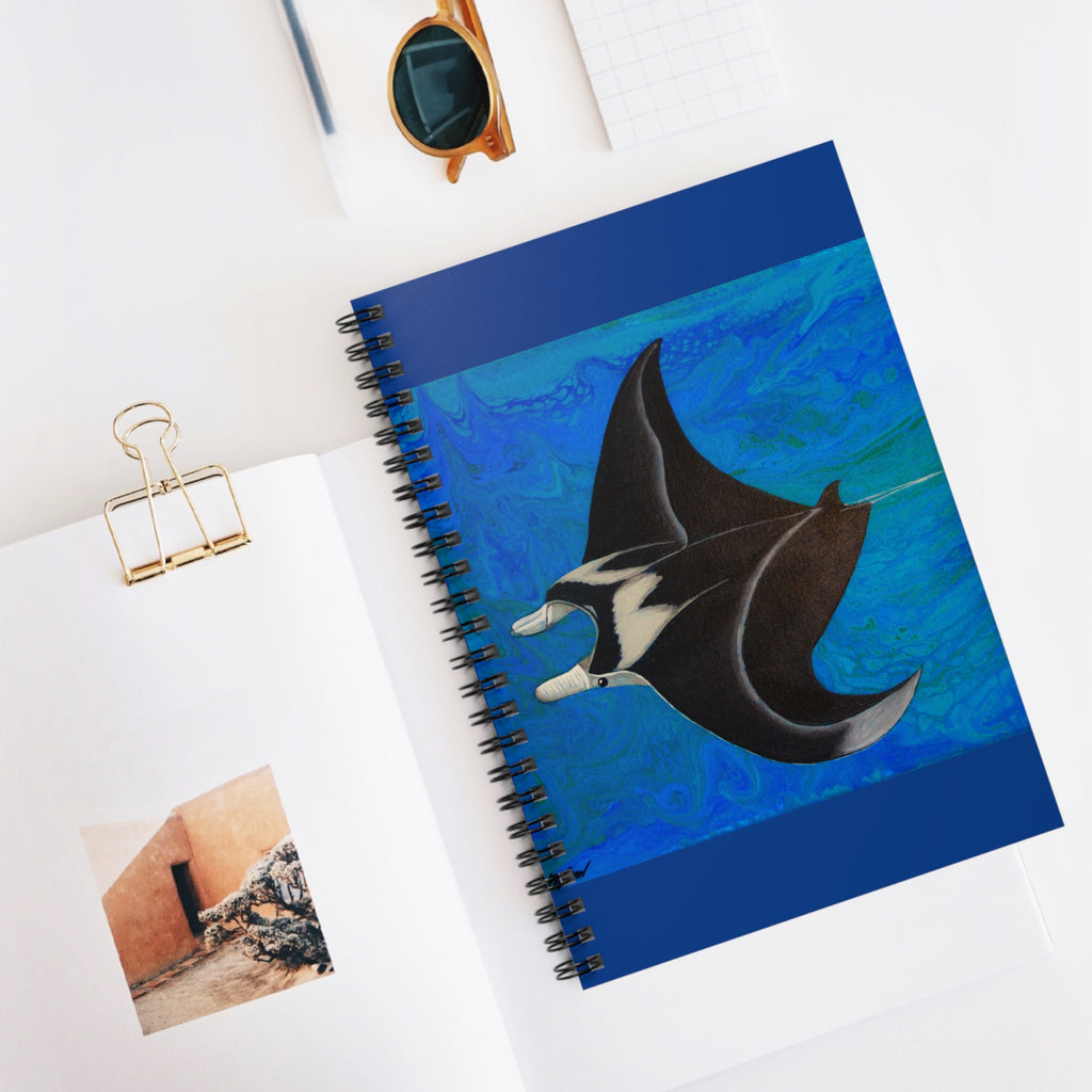 Notebook with a manta ray design on a white surface