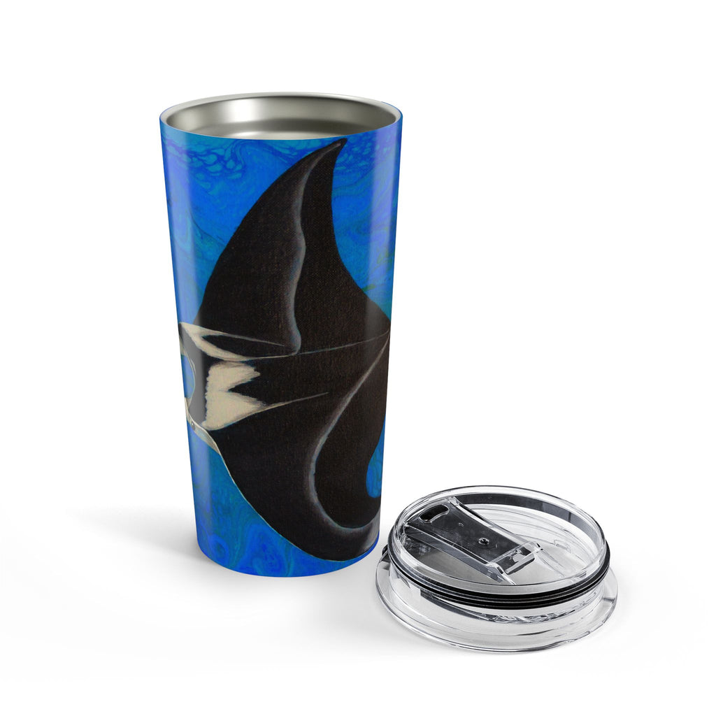 Tumbler with shark design on a blue background