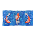 Towel/blanket with koi fish design on a blue water background