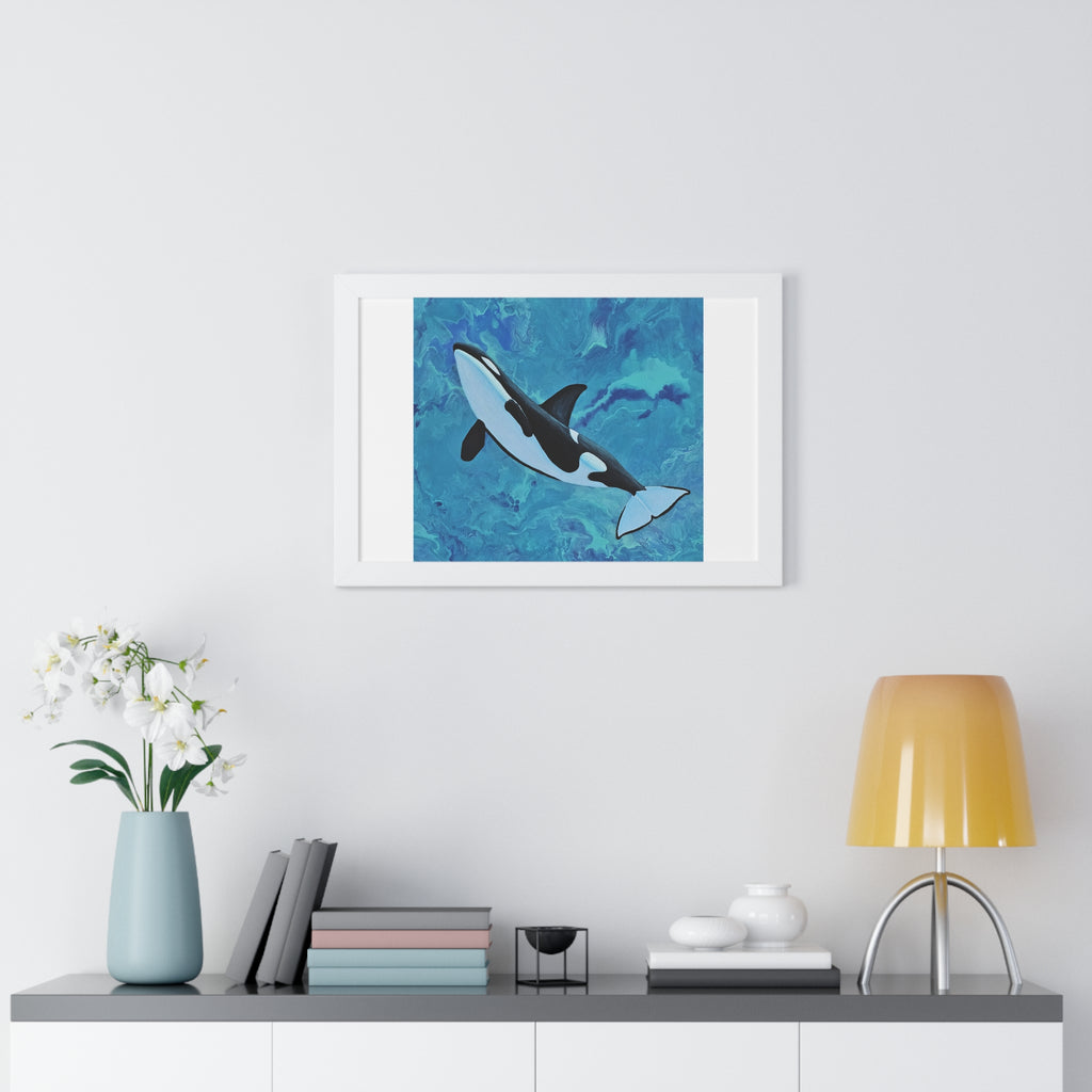 Framed artwork of a whale on a wall above a shelf with decor items.